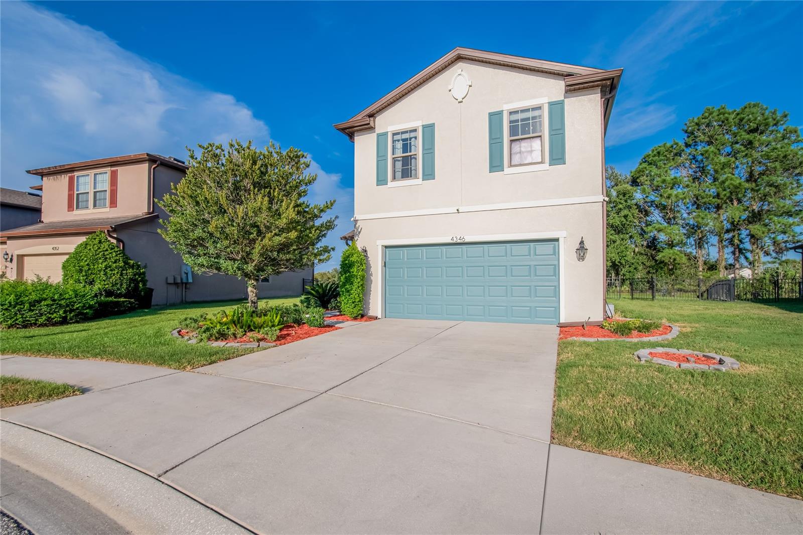 Welcome to Florida living at its finest in the Country Walk community of Wesley Chapel! Situated on a premium cul-de-sac lot with a beautiful pond view, this well-maintained 4-bedroom, 2.5-bath home offers the perfect combination of comfortable living and incredible outdoor amenities.Inside, you'll find an inviting open-concept layout with a combination of ceramic tile and carpet flooring, warm neutral tones, and plenty of natural light. The spacious kitchen features granite countertops, rich wood cabinetry, stainless steel appliances, and a large island with seating, flowing seamlessly into the dining and living areas. Power window shades are installed downstairs s except the downstairs adding both convenience and style.Step outside to your own private backyard oasis! The heated saltwater pool, built in 2021, features customizable LED pool lighting and is surrounded by a spacious screened enclosure equipped with a Nebula Rail lighting system, allowing you to customize the lighting to create the perfect ambiance for relaxing or entertaining. A custom putting green, added in 2022, provides the perfect space for recreation and entertaining. The yard is beautifully landscaped and enclosed with attractive iron fencing, all overlooking the peaceful pond. Gemstone Lights adorn the exterior of the home, offering customizable accent lighting and enhanced curb appeal. Exterior security cameras and a Ring doorbell are also included.The first floor offers a bedroom, currently being used as a dedicated home office, along with a convenient half bath. Upstairs, you'll find a spacious loft/flex space, a primary suite with a custom-built closet and upgraded ensuite bathroom, plus two additional bedrooms and a full bath.Country Walk offers exceptional amenities and added value with the HOA including high-speed internet, cable, weekly lawn care, and pressure washing twice a year, along with access to the community clubhouse, pools, playground, tennis courts, fitness center, dog park, and beautifully maintained green spaces.Conveniently located near major highways, highly rated schools, shopping, dining, and entertainment, this home offers the best of the Wesley Chapel lifestyle.Pool, pond view, putting green, oversized cul-de-sac lot, flexible living spaces, Nebula Rail and Gemstone lighting, and an HOA that takes care of the extras—this one is a must-see!