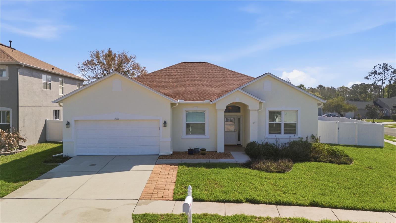 Welcome to this beautifully maintained 4-bedroom, 2-bath pool home located in the highly sought-after Grand Oaks community of Land O’ Lakes. Situated on a spacious corner lot measuring .23 acres (10,220 sq. ft.), this 2,079 sq. ft. home offers the perfect balance of comfort, style, and Florida outdoor living. Step inside to find tile flooring throughout, creating a clean, cohesive look and easy maintenance. The updated kitchen features stone countertops, new stainless steel appliances, and plenty of space for cooking and entertaining. The home also includes a formal dining room and a bonus room accented with crown molding, adding character and flexibility for gatherings, a home office, or additional living space. Enjoy the Florida lifestyle year-round in your fully screened-in in-ground pool, overlooking a fully vinyl-fenced backyard that offers privacy and room to relax, entertain, or let pets play freely. Major updates provide peace of mind, including a new roof (2021), HVAC system, and water heater replaced in 2020. Grand Oaks is known for its beautiful tree-lined streets, parks, playgrounds, community pool, clubhouse, and tennis courts, creating a welcoming neighborhood atmosphere. Residents enjoy convenient access to top-rated schools, shopping, dining, and major roadways, including SR-54 and the Suncoast Parkway, making commuting to Tampa, Wesley Chapel, and Tampa International Airport simple. Nearby attractions include The Shops at Wiregrass, Tampa Premium Outlets, golf courses, nature trails, and numerous parks, offering endless options for recreation and entertainment. If you’re looking for a well-maintained pool home in one of Land O’ Lakes’ most desirable communities, this property offers comfort, convenience, and value all in one. Schedule your private showing today.