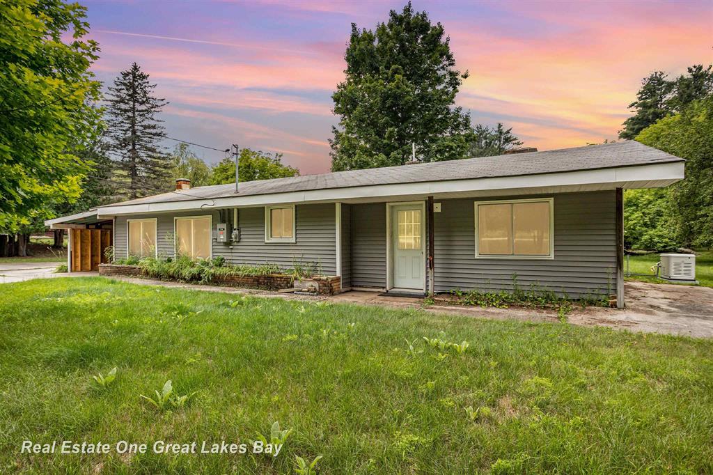 Charming Ranch on 8 Acres.  Welcome to this 1207 Sq ft Spacious home Nestled on Beautiful 8 Acres at the end of a quiet dead-end road. This 1-bedroom could be easily be 2 or more with a creative mind. Lots of Vintage Character and plenty of room to make it your own. You will appreciate the U shaped driveway, covered carport entry. Old Fashioned Root Cellar sits just off the drive, perfect for storage or canning. Home features attached 2-car garage, with additional garage door off the back for lawn mower. 2 addltional wood sheds ideal for small animals, horses, storage. Updates include, Newer Vinyl Siding, Newer Windows, Generac Generator. Natural Gas, Well and Septic. Plenty of Room to Roam, this property combines country living with potential for the right buyer. Minutes from Town. Close to Harrisville State Park and Lake Huron. Bring your vision and restore this home into perfect slice of Paradise. MOTIVATED SELLER.