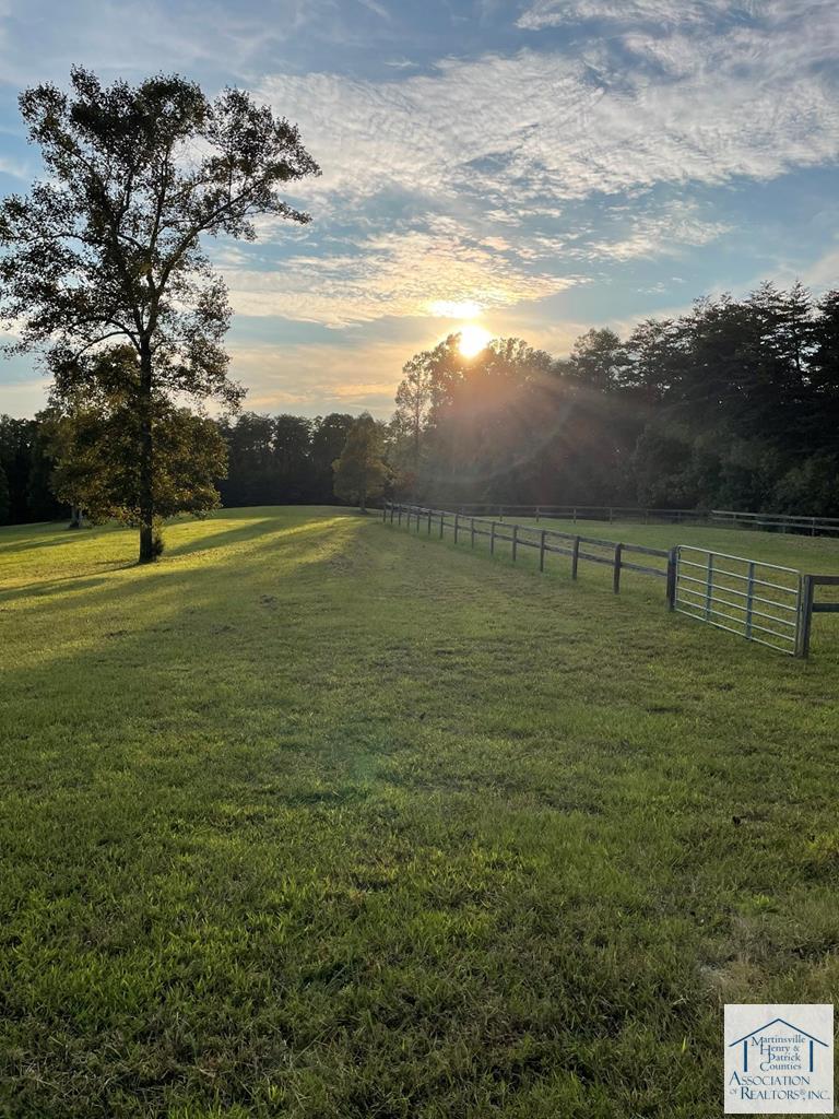 Horseshoe Farm- pristine 95.8 acres in the foothills. Never offered on the market, this beautiful acreage was developed as a family compound with a home and guest cabin, 2 stall barn with studio and office, ridiing ring and shared frontage on a 1.5 acre pond. The farm features approx. 27 acres of manicured fields and over 2000 ft. of maintained gravel drives, The main home was built in the Salt Box style with open floor plan and soaring wood beams overhead. Attention was placed on appreciation of the natural world with screened porches that span the length of the home. A tobacco barn was renovated into a guest cabin with deluxe amenities like inground pool and hot tub. The guest cabin is perfect for family and friends.  When opportunity knocks....