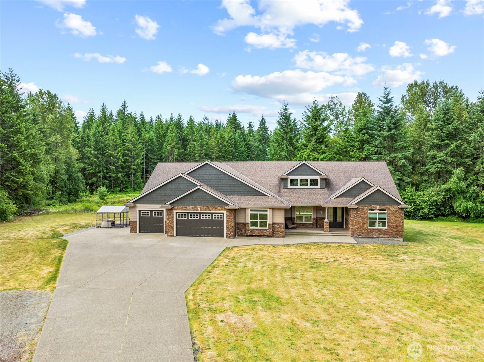 Custom 3,280 sqft home on 5 private acres with 4 beds, a bonus room & 4.25 baths. The luxurious primary suite features two walk-in closets, a dressing room, double sinks, walk-in shower, jetted Japanese soaking tub, and deck access. Two guest suites include private baths. Vaulted ceilings, oversized windows, and a wood-burning Xtrordinair® fireplace create a light-filled, inviting interior. The chef’s kitchen boasts granite counters, double ovens, and a large island. Living room opens to a spacious deck. Wide hallways, large doorways, and peaceful, forest-lined seclusion. Located just minutes from I-5 and all essential amenities, centrally located between Portland and Seattle.