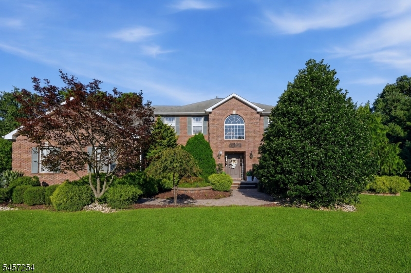 Welcome to this impressive 5-bedroom Colonial in Monroe Township, offering spacious living, thoughtful design, and exceptional versatility. The first level features a welcoming layout with a bedroom, half bath, dining room, living room, well-appointed kitchen, and convenient laundry room. Three fireplaces add warmth and character throughout the living spaces.Upstairs, four generously sized bedrooms include a private primary suite with a full bath and sitting room, creating a comfortable retreat. The finished full basement expands the living space with a recreation room, additional bedroom, and wet bar?ideal for entertaining, guests, or flexible living arrangements.An attached 3-car garage provides excellent parking and storage. Situated just minutes from NYC-bound transportation, major roads, and excellent schools, this property offers both convenience and space in a desirable Monroe Township location.
