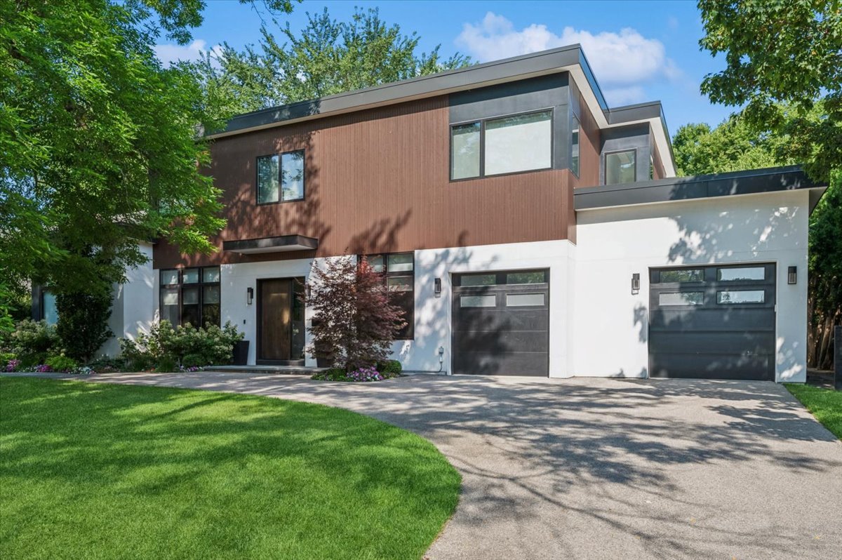 Custom-built in 2019, this 5-bedroom, 4.5-bath Kenilworth residence sits on approximately one-third of an acre and offers a rare indoor sport court, first-floor guest suite, and a light-filled open floor plan designed for today's modern living and entertaining. Thoughtfully designed for both everyday comfort and elevated living, the home features soaring 12-foot ceilings, radiant-heated floors, architectural doors, and oversized Marvin Integrity windows that flood the interiors with natural light while maintaining privacy through integrated automated blinds. The kitchen is both beautiful and highly functional, appointed with bespoke cabinetry, heat-resistant quartz countertops, and an exceptional appliance suite including dual Miele dishwashers, a Gaggenau gas and induction cooktop, and Wolf steam and convection ovens with a warming drawer. Undercounter Sub-Zero refrigerator, ice maker, a walk-in pantry, and an expansive island with seating make the space ideal for daily living and effortless entertaining. Adjoining living and dining spaces feature custom cabinetry, Lightology fixtures, and a sculptural metalwork gas fireplace. A private office with oversized barn doors, built-in cabinetry and built-in shelving creates a quiet and elegant workspace. A first-floor bedroom with a full bath offers flexible accommodations for guests or extended stays. A large mudroom provides exceptional functionality with generous storage and organization. Recreation and wellness are seamlessly integrated into the home's design, highlighted by a private indoor Sport Court with basketball hoop and customizable logo, a glass-enclosed fitness studio, and a sun-filled recreation lounge with French doors opening to a raised Trex deck. Outdoors, the fully fenced backyard features a built-in firepit patio-ideal for gathering, relaxing, and entertaining. The second level is anchored by a serene primary suite with a spacious professionally designed California Closet and a spa-inspired bath featuring heated floors, dual vanities, Kohler fixtures, a soaking tub, and a separate shower. Three additional bedrooms offer tailored storage solutions, blackout and automated blinds, and access to beautifully designed ensuite or Jack-and-Jill bathrooms. A full second-floor laundry room with sink, folding surface, and generous storage adds everyday convenience. Additional highlights include Control4 smart-home integration, Sonos wiring, advanced security, a whole-home Generac generator, three-zone HVAC, central vacuum, dual sump pumps, a heated front stoop, a heated two-car attached garage, and a circular driveway for effortless access. Do not miss this exceptional offering combining modern design and an unbeatable lifestyle with walk to school, train and beach!