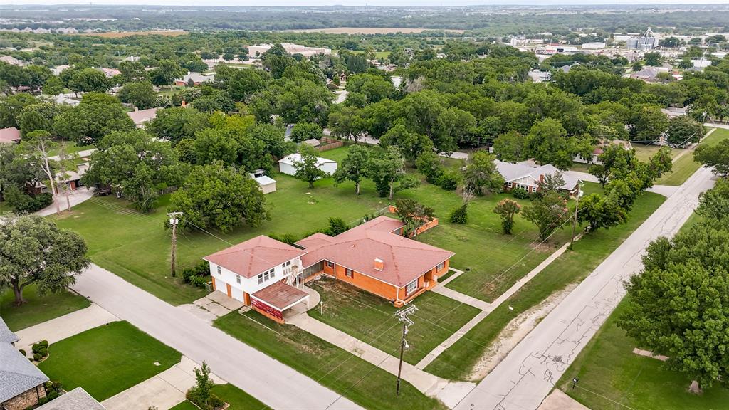 Situated on a large .643-acre corner lot in the heart of Old Town Justin, this 3-bedroom, 2-bath home offers tons of potential! Adding even more possibilities is a 1-bedroom, 1-bath apartment above the garage, ready for your vision and finish-out. The property is being sold as-is and offers a great opportunity to renovate and make it your own. Enjoy the character of an established neighborhood with convenient access to shopping, dining, grocery stores, coffee shops, parks, and more. A rare opportunity with plenty of room and potential—come see the possibilities!