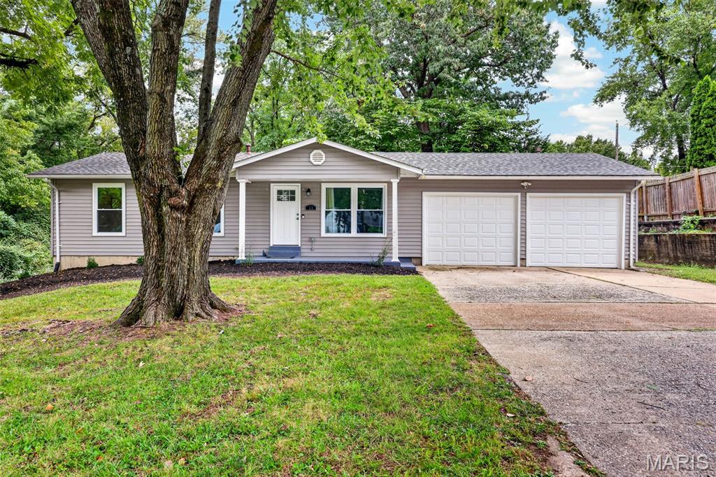 DON'T MISS OUT ON THIS ONE! Lots to enjoy about this updated, move-in ready home in Francis Howell Schools! Greeted by timeless curb appeal,  covered front porch, newer vinyl siding and roof. Interior offers lots of updates with modern finishes. Designer kitchen w/ white shaker soft close cabinetry, granite counters, breakfast bar, stainless appliances and 2 pantries. Updated bathrooms w/custom white subway tile. Living Room and Family Room with gas fireplace and French doors leading to the deck overlooking the large back yard. Primary suite with full bath & 2 add'l bedrooms and hall bath on main floor. Part finished walkout basement (painted floor, ceiling, some drywall, electric) w/sliding door plus add'l basement hobby/workshop area. Updated electric, newer siding, architectural shingle roof, windows, water heater, landscaping. Car/truck lover? You have to see the oversized garage with newer 10x8 doors; newer openers, new paint, flooring, carpet, doors. Easy highway access, shopping & more!  This one won’t last long and is ready for you to call it home.