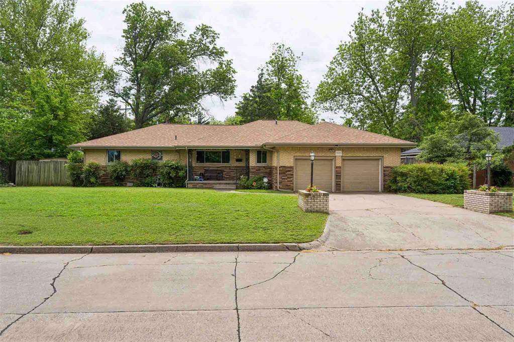 ***Price Reduced*** on this charming home situated on nearly 1/3 of an acre, where generations of the same family have lovingly cared for the property! From the moment you step inside, you’ll appreciate the spacious living room featuring beautiful hardwood floors that flow seamlessly into the dining area. The kitchen is full of original charm with timeless wood cabinetry, stainless steel appliances, and unique character you won’t find just anywhere.This versatile floor plan also includes a large second living area that could easily serve as an additional bedroom, game room, or flex space to fit your needs. The beautifully remodeled hall bathroom is a true standout, showcasing elegant marble finishes and a stunning oversized shower. The primary bedroom offers hardwood floors and generous space, while the additional bedrooms are comfortably sized and full of natural light.Major updates provide peace of mind, including a new roof, new HVAC system, new siding, new sewer line, new guttering, new front door, new back double-door and new champion windows. The spacious utility room features built-in cabinetry and leads directly to the two-car garage for added convenience.Step outside to enjoy the gorgeous backyard, complete with a beautiful deck, privacy fence, storage building for lawn equipment, and your very own Jacuzzi tub—the perfect place to unwind. Conveniently located close to shopping, just minutes from the University of Oklahoma, and near all the excitement of Boomer Sooner country, this home offers the perfect blend of charm, updates, and location. Don’t miss your opportunity to make this special home your own!