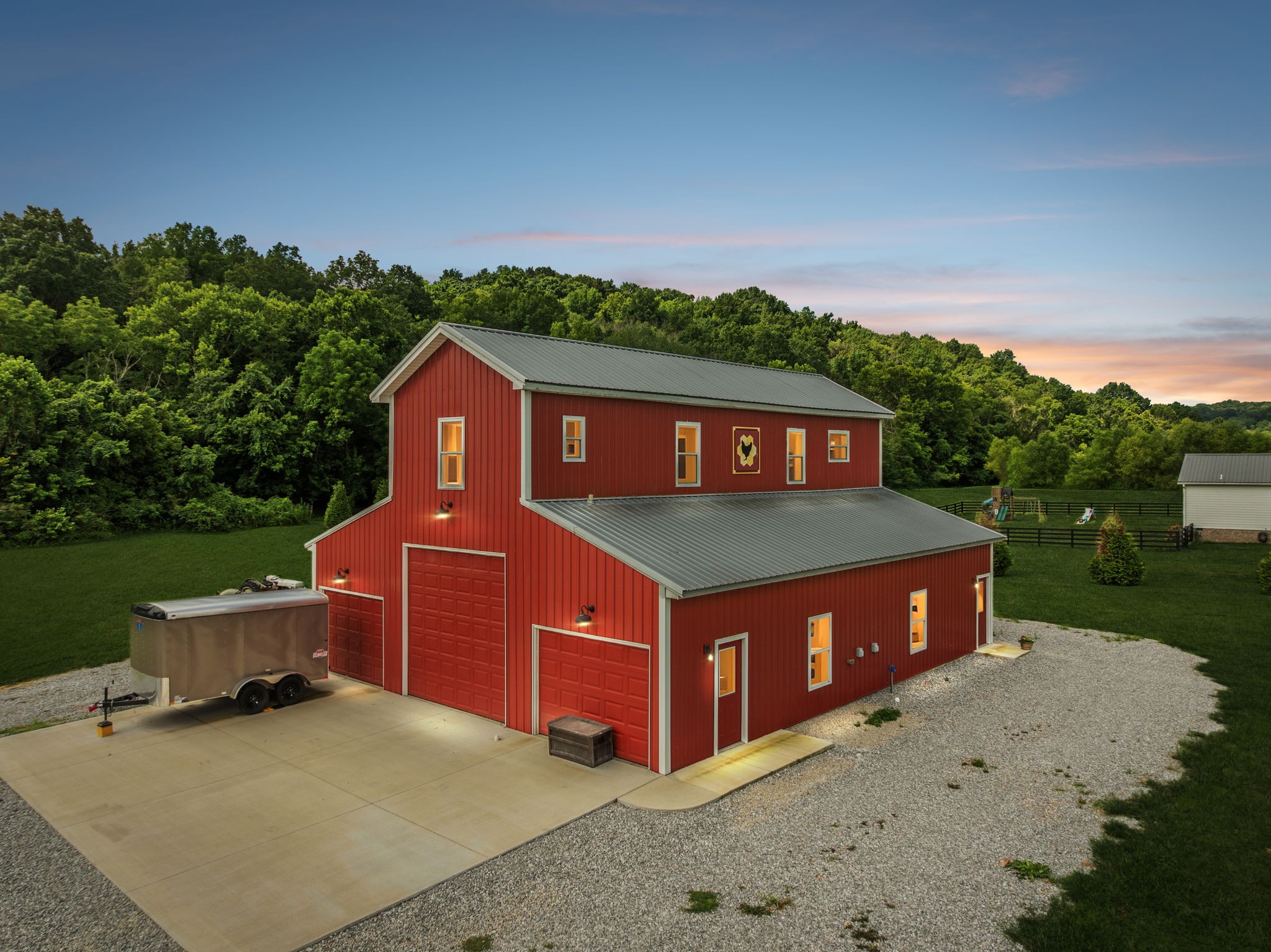Build your dream home on this stunning 7.63-acre property nestled in the heart of charming Hampshire, TN. This picturesque land backs up to a year-round creek and includes a versatile barn with a garage below and approximately 800 square feet of finished living space above—perfect for living on-site while you build. The barn is equipped with two bathrooms, kitchen, laundry room, storm shelter, and more.  The homesite is perked for four bedrooms, with septic already installed and utilities in place—ready for construction. Enjoy the peace and charm of small-town living with convenient access to Columbia, Spring Hill, and beyond. You're just 50 minutes from downtown Franklin and about 65 minutes to downtown Nashville (per Google Maps). This is a rare opportunity to own a ready-to-build property that offers space, functionality, and natural beauty—all in an idyllic setting.