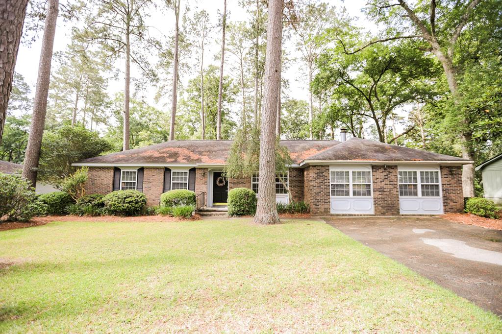In-town, established neighborhood, near hospital and country club and easy access to downtown and schools. What more could you ask for? Originally built in 1974, this one level home features 3 bedrooms and 2 bathrooms with formal dining, formal living and family room in 1,947 sf. The kitchen has white cabinets and hard surface countertops and breakfast bar. Bonus room off of the breakfast room is perfect for additional storage or a place to tuck away a home office. The master bedroom has an ensuite tile bathroom and two additional bedrooms share a hall bathroom. The oversized family room features a wood burning fireplace and built-in bookcases. The sunroom is great for year-round enjoyment with an additional 220 sf under roof. Beautiful, fenced backyard has mature landscaping and a small storage building. Call today to see this wonderful home to call make your own.