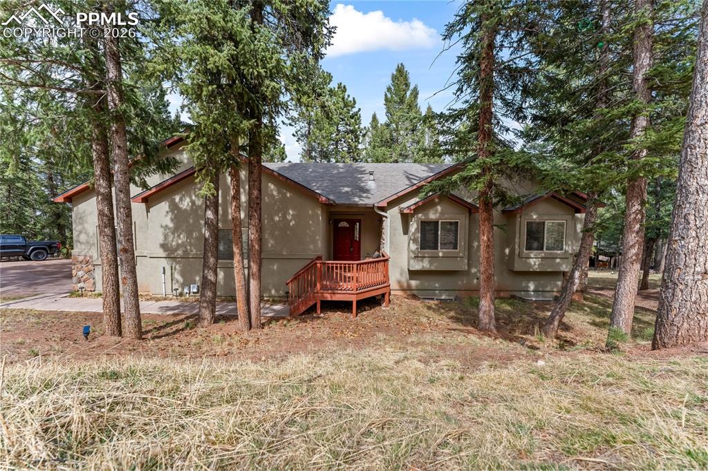 Welcome to an incredibly spacious and versatile home offering 3,561 square feet, 7 bedrooms, and 3 bathrooms, perfectly situated on a quiet circle street on a generous 0.51-acre lot.This home is designed for flexibility, featuring full kitchens on both the upper and lower levels—ideal for multi-generational living, rental potential, or accommodating guests with ease. The upper level showcases vaulted ceilings that create an open, airy feel, complemented by beautiful stone countertops and a functional layout that flows seamlessly for everyday living and entertaining.Enjoy the Colorado outdoors from both the front and back decks, offering space to relax, take in the surroundings, and enjoy the peaceful setting. With seven bedrooms, there’s no shortage of space for family, work-from-home setups, or hobby areas.The oversized lot provides additional room to spread out, while the quiet, circular street adds privacy and minimal traffic—making this an ideal setting for those seeking both space and tranquility.With a 2-car garage, expansive square footage, and endless possibilities, this property is a rare opportunity for buyers looking for value, flexibility, and room to grow. Come check out this wonderful home today!