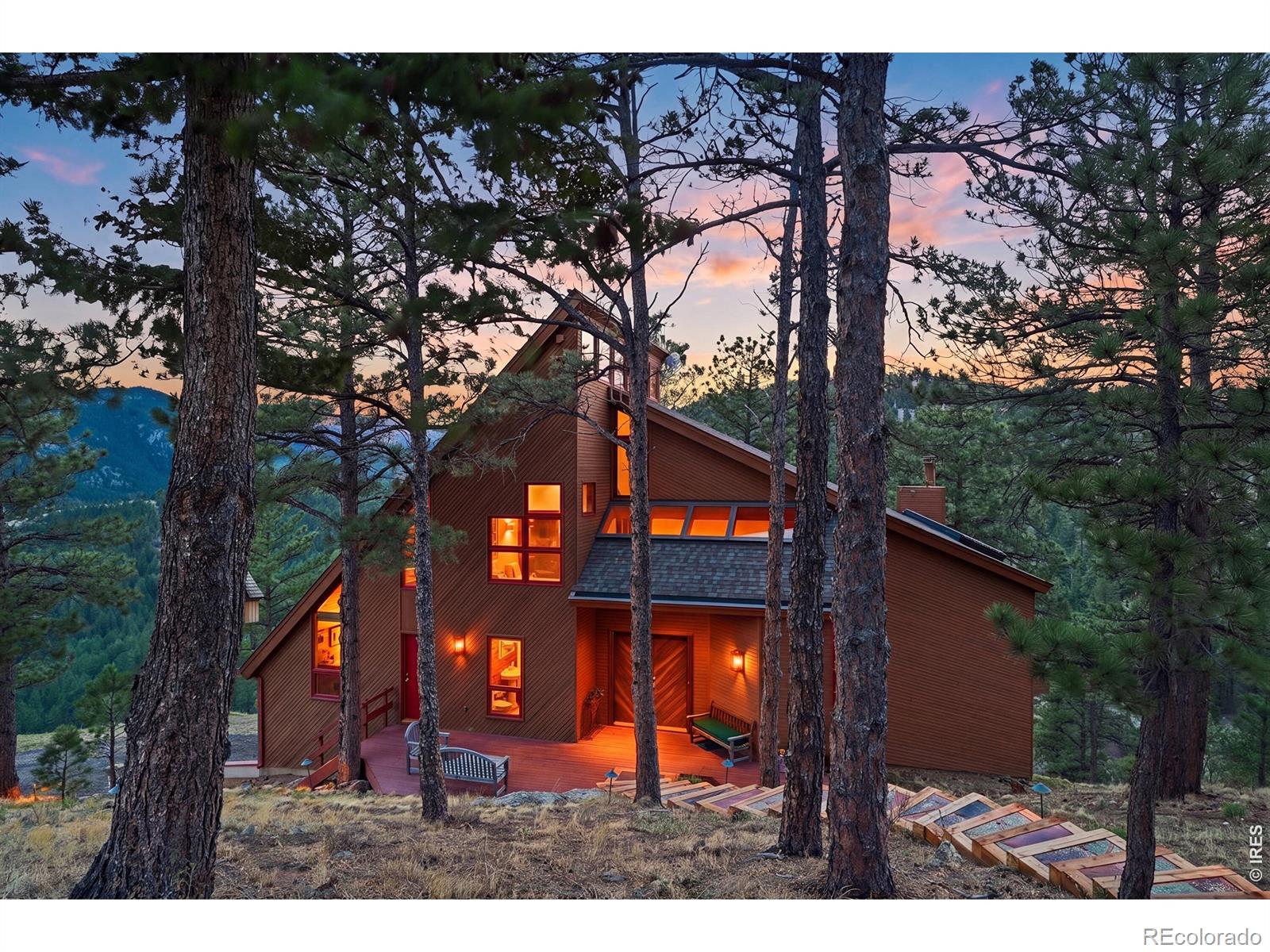 Perched in the serene beauty of the Boulder foothills, this exceptional residence offers a rare balance of tranquility and proximity-just eight minutes from the vibrant heart of downtown. Here, quiet stillness and sweeping grandeur coexist, with astonishing 270-degree views stretching across the Continental Divide and the iconic silhouette of Bald Mountain.The home's interior is equally compelling. A refined, mid-century-inspired primary bedroom evokes timeless sophistication, while the thoughtfully renovated kitchen pairs understated elegance with top-tier performance. Honed granite countertops, a Sub-Zero refrigerator, and a Wolf range create a culinary space that is as functional as it is striking.The walkout lower level extends the home's versatility, opening seamlessly to the surrounding landscape and inviting indoor-outdoor living at its finest and would suit perfectly for a VRBO rental with separate entry if so desired.This is more than a home-it is a private retreat defined by light, space, and the quiet luxury of nature at your doorstep. Showings start Saturday, May 2.
