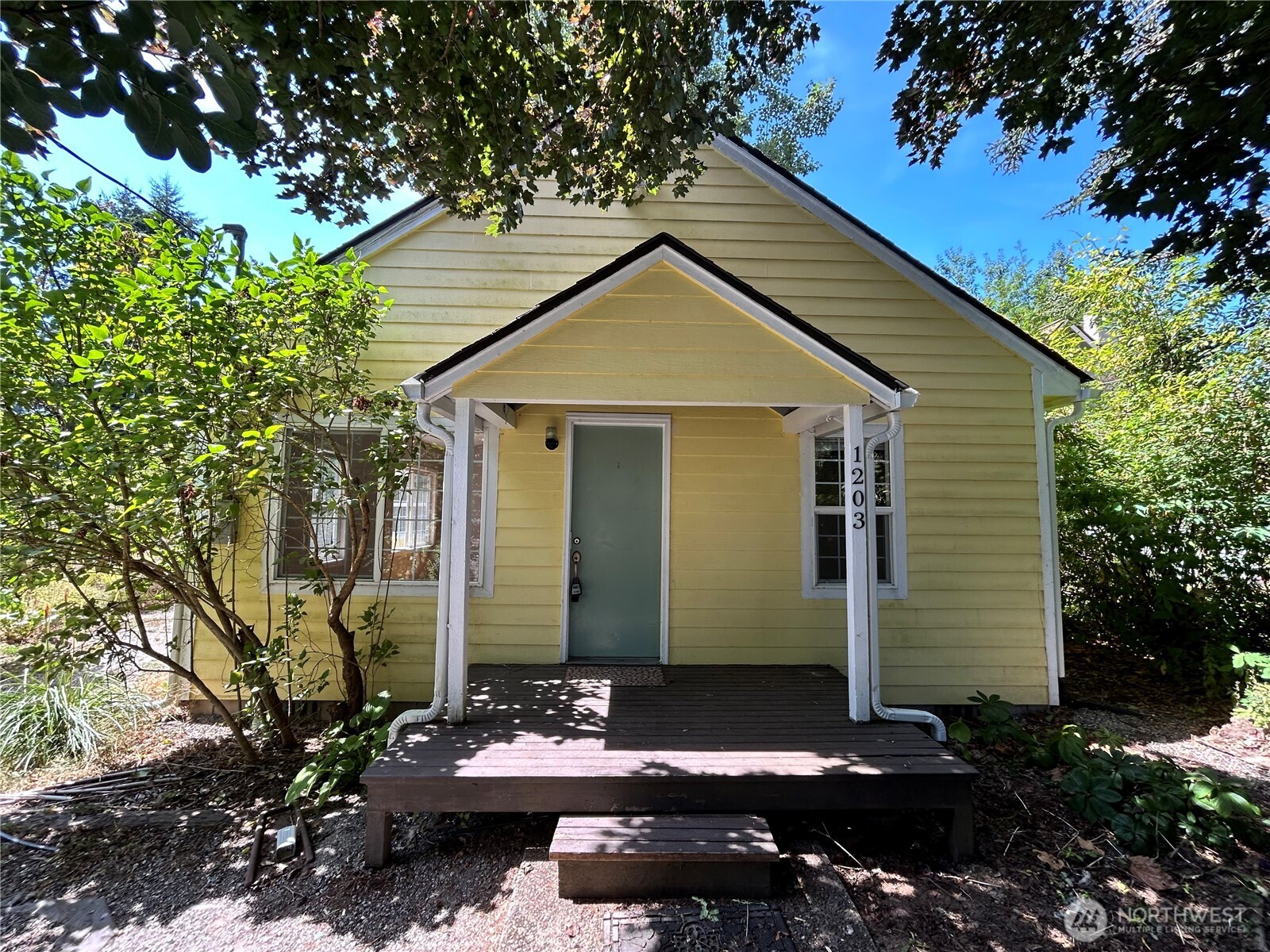 Location, location, location! This property is located in Northeast Olympia near Roosevelt Elementary School and the famous San Francisco Street Bakery. Sitting on a quiet residential street this home has 832 square feet spread between 2 bedrooms and 1 full bathroom. As you walk through the door you are greeted by the living room with warm wood floors, vaulted ceilings, and a comforting free standing gas stove for the fall and winter. Two generous sized bedrooms, a full sized bathroom, and dining room make this home live much larger than its square footage indicates. The kitchen, along with additional eating area, provides plenty of space and walk thru access to the large backyard. The backyard is partially fenced with a raised rear steps, outbuilding, and your own grapes growing on a trellis. Located close to amenities, major arterials, and Joint Base Lewis-McChord. A perfect home for the first time home buyer, those looking to downsize, or as an investment. This home with a little bit of sweat equity checks all of the boxes!