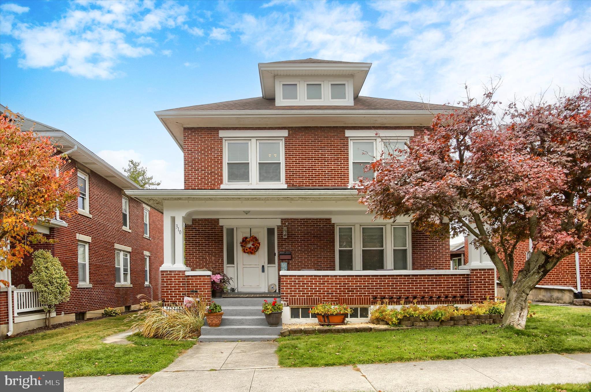 Welcome to 310 W Caracas Avenue — a charming well-built brick home located in the heart of Hershey! This 4-bedroom, 2-bath residence offers timeless character and unbeatable in-town convenience. Step inside to find classic architectural details including original woodwork and  pocket doors. The spacious layout features a formal living room, dining room, and a beautiful and updated kitchen featuring a large breakfast counter, enhanced lighting, granite counters and stainless appliances. There is a spacious mudroom/laundry off of the kitchen plus a powder room for convenience. Upstairs, you’ll find four nicely sized bedrooms and a full bath, providing plenty of space for family or guests. The lower level includes access to utilities and  additional storage. Enjoy the classic curb appeal with a covered front porch and mature landscaping. Sit on your front porch and enjoy the summer concerts at Hershey Park! A detached 2-car stone garage provides off-street parking. Don't miss the backyard oasis including a stunning paver patio and walk way. covered pavilion, bistro lighting and much more. Situated on a flat, perfectly sized lot, this home is within walking distance to downtown Hershey’s shops, restaurants, Hershey Theatre, and schools in desirable Derry Township. This is a rare opportunity to own a piece of Hershey history with endless potential where you can walk outside and smell the chocolate! Schedule your showing today and imagine the possibilities!
