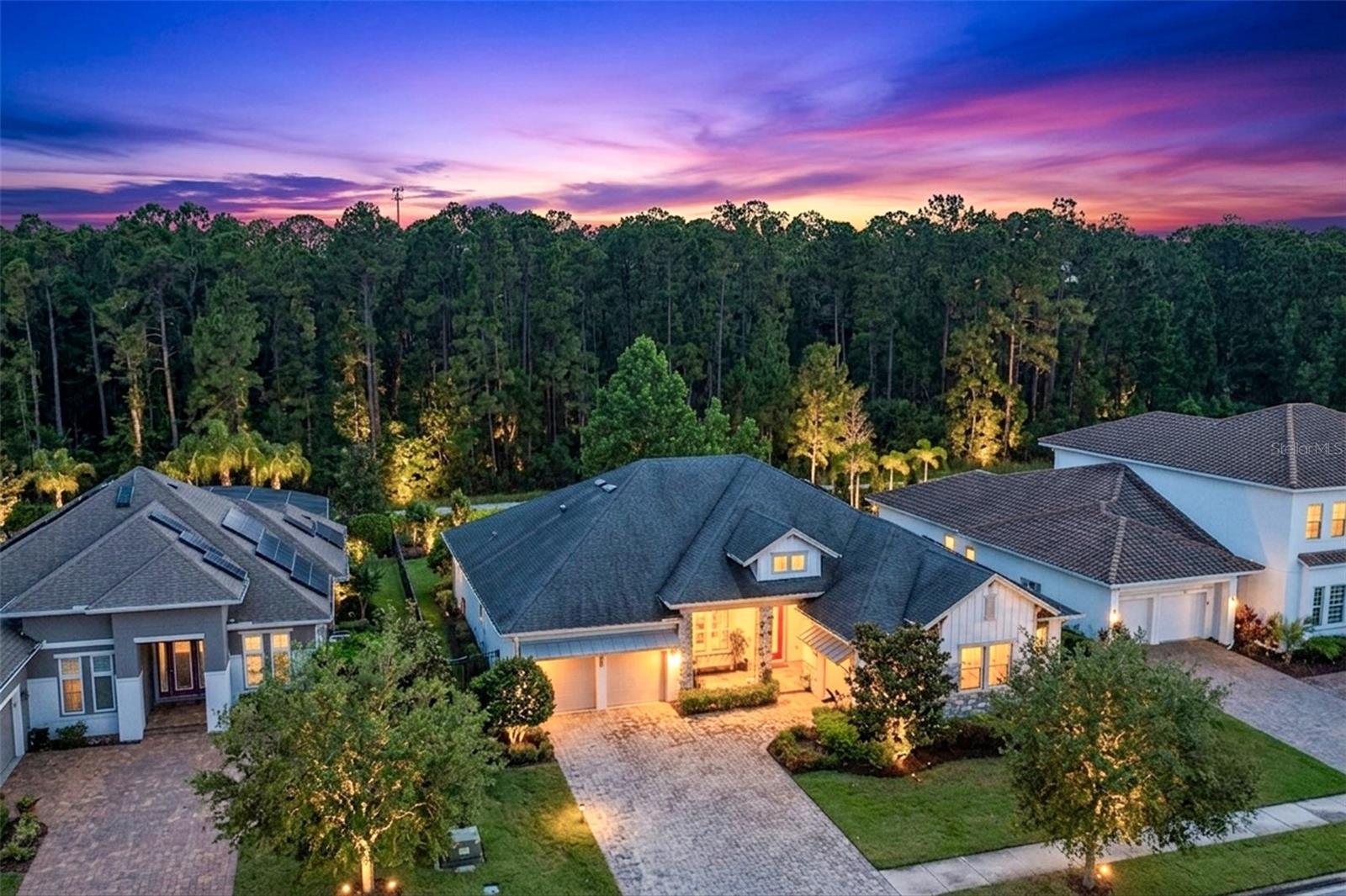 Very Rare Estate home with CONSERVATION VIEWS in Lake Nona’s premier community of Laureate Park. With 4 bedrooms, 4.5 bathrooms, an office, and a versatile flex space/playroom, this thoughtfully designed home is tailor-made for both relaxing and entertaining. At the entrance, a foyer and office greet you. The heart of this open concept floor plan is the gourmet kitchen, featuring sleek stone countertops, modern hardware, stainless steel appliances, built-in ovens, ample cabinetry, pantry, upgraded wood flooring throughout and an oversized island with views of the large backyard and conservation. The open-concept floor plan seamlessly connects the kitchen, dining area, and living room, making it perfect for year-round entertaining. The primary suite will not disappoint with nature views, a trayed ceiling, spa-like bathroom with a large frameless shower and extended walk-in closet with built-ins. All additional bedrooms are generously sized, perfect for family or guests, while the versatile flex room offers the ideal space for a playroom or second living area. Step outside to experience your beautiful OUTDOOR OASIS complete with extended lanai, triple sliding glass doors, and an extended fenced-in private backyard that is the ideal space to enjoy time with family and friends. Must see in person to fully appreciate every detail of this immaculate home. Additional notable features: epoxy floored 3-car garage, Solar, Tankless Water heater, and whole home water filtration system.  Situated in Laureate Park, this family-friendly community offers a harmonious blend of natural beauty and modern amenities. Enjoy the aquatic center with its 3 pools, or engage in outdoor fun at the tennis and basketball courts, pocket parks, and scenic walking trails. For those who love technology, Laureate Park includes Gigabit Fiber Internet to every home. Located near the vibrant Lake Nona Town Center and top-tier Medical City, this neighborhood is close to countless shopping and dining options including the extraordinary Lake Nona West shopping complex. This extraordinary residence is a rare opportunity; arrange your exclusive showing today!