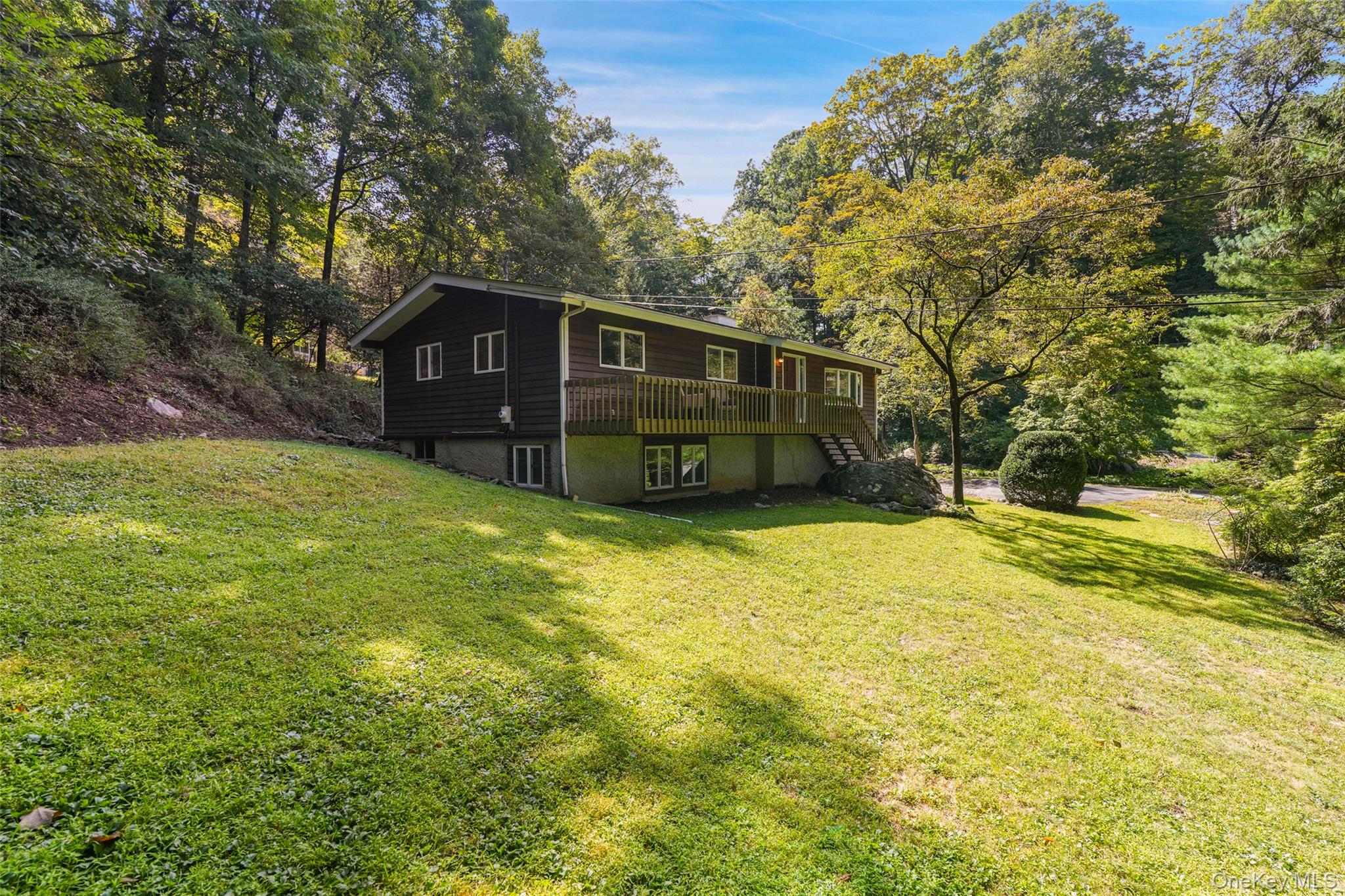 Lake Katonah living!     Move right in to this vibrant lake community.  
First floor primary bedroom w/bath and 2 additional bedrooms w/ hall bath on the main floor. Living room features a cozy fireplace.  Beautifully updated kitchen with quartz counters and stainless appliances.  Fabulous great room with tons of natural light, hardwood floors and vaulted ceilings on main floor.  Lower level houses the laundry room, office and workshop.

Lake Katonah offers its members a private beach, tennis, pickleball, playground, clubhouse and community well.   Lake Katonah is surrounded by 300 acres of the Bedford Audubon trails, within a mile of Increase Miller elementary school in the Award - winning Katonah Lewisboro school District.   Short drive into charming Katonah village with it's shops and restaurants. Close to Metro North and commuting arteries.  Don't miss your chance to live in this special community!