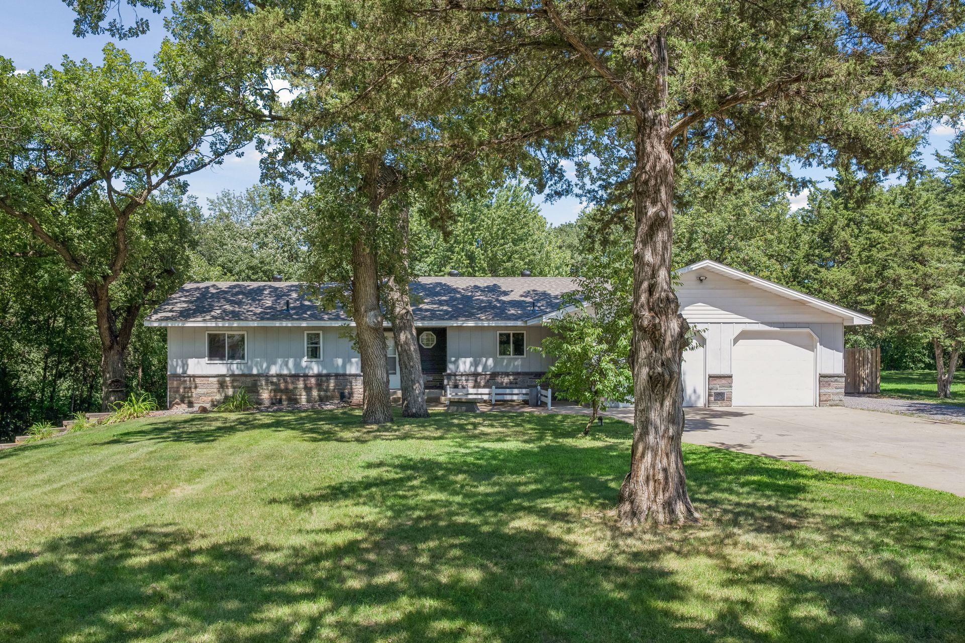?? Country Living, Room to Roam & Space for All Your Toys! ??Whether your family is growing and you want more space in the coveted ROCORI School District, or you’re an empty nester or retiree looking for convenient one-level living, this beautiful property checks all the boxes!This beautifully maintained 4-bedroom, 3-bath walkout sits on a private, wooded one-acre lot just minutes from Cold Spring. Featuring a brand-new roof (2026), spacious living areas, and thoughtful updates throughout.The expansive kitchen offers granite countertops, newer stainless appliances, abundant cabinetry, and plenty of natural light, flowing into a vaulted family room with patio doors leading to a gorgeous multi-tiered deck overlooking the backyard.The main level includes laundry, a private primary suite, and a second bedroom, while the finished walkout lower level offers a family room, play area, and two oversized bedrooms.Outside, enjoy front and back decks, a fire pit, large play area, and your own sledding hill—plenty of room for kids, pets, gatherings, and outdoor adventures.And for the hobbyist or outdoor enthusiast, there’s an insulated/heated oversized garage plus a 28' x 36' outbuilding with concrete floor, electricity, and a 16' x 9' overhead door—perfect for your fishing boat, golf cart, vehicles, toys, or workshop.Privacy, acreage, space, and country charm—all close to the conveniences of Cold Spring. ????Come see why this is the kind of property you’ll want to call home!