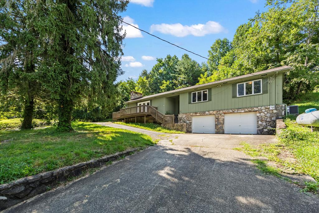 Charming Handicap-Accessible Home in the Heart of Bryson City  Welcome to 30 Arlington Extension, a delightful 3-bedroom, 2-bath home on a .69-acre lot. This single-level home offers convenience, comfort, and plenty of space with large bedrooms, a spacious bathroom, and a spacious kitchen perfect for cooking and gathering. The inviting living area features a beautiful rock fireplace, creating a warm and welcoming atmosphere for family and friends. With its handicap-accessible design, this home ensures ease of living for everyone. Enjoy the best of both worlds—in-town convenience with shops, restaurants, and attractions just minutes away, and a generous lot that provides room to relax and unwind. Whether you're seeking a full-time residence, vacation getaway, or investment property, this home offers the perfect blend of functionality, location, and mountain charm. Don't miss your chance to own this Bryson City gem!