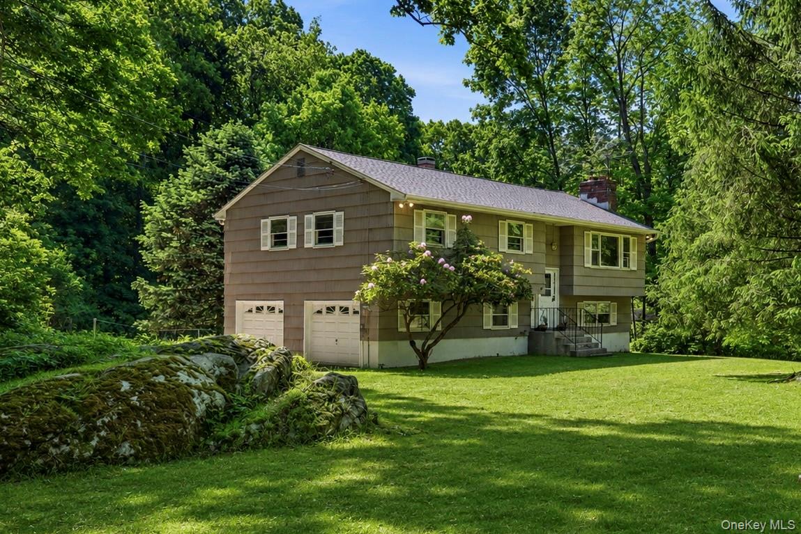 Welcome to 17 Yerkes Road in North Salem. Tucked away near Lake Hawthorne and surrounded by scenic horse farms, this charming 3-bedroom, 2-bath raised ranch offers a rare blend of privacy, tranquility, and quintessential country living. Set on a quiet road in one of Northern Westchester’s most picturesque pockets, the home is embraced by nature and neighboring equestrian estates.Inside, an open-concept layout and oversized picture windows invite natural light throughout while showcasing the peaceful landscape beyond. Step outside to the expansive back deck and enjoy serene mornings immersed in the sounds of nature. The lower level provides flexible bonus space ideal for a family room, home office, gym, or guest accommodations.Conveniently located near hiking trails, riding facilities, and the charming town centers of both North Salem and Lewisboro, this home offers the perfect balance of rustic beauty and everyday accessibility. Whether as a full-time residence or weekend retreat, this is a special opportunity to enjoy the quiet elegance of country life. Less than 10 minutes to Goldens Bridge train station & 684 for an easy commute into NYC.