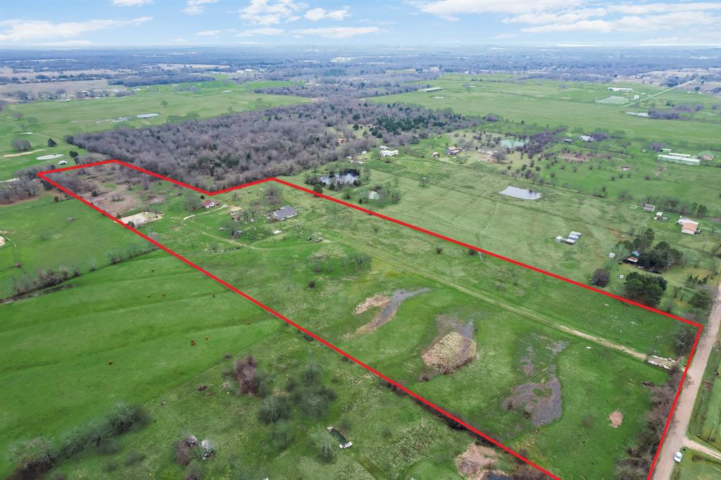 19 acres, AG Exempt, that is 5 minutes from Cedar Creek Lake. This property is cross fenced with 5 
pastures with field fence and mix with horse and pipe corners with some panels. 11 of the acres is in 
Henderson County and Eustace ISD. 7 of the acres is in Mabank ISD so you have your choice of schools. 
There is one pond in the back, another by the barn with water and electric and concrete slab flooring but 
needs work, and there is one pond up front. In addition, there is a dog kennel, multiple spickets for water, 
and Electrical drop to house and barn. The home is sold as is and not as a tear down.