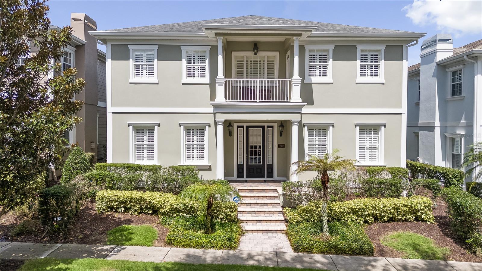 This stunning 5-bedroom, 4-bathroom home is located in the prestigious Reunion Resort and offers nearly 5,000 sq. ft. of living space. A transferable Reunion Resort membership is included. Lovingly maintained as a second home (never used as a rental), the property is in excellent condition and filled with elegant touches throughout.

As you enter, you’re greeted by a spacious open floor plan featuring beautiful wood floors, stately columns, and custom drapes. The formal dining room and informal living area create a welcoming flow, while the main living room offers a gas fireplace and sliding doors that open to a serene courtyard with built-in spa.

The kitchen is generously sized with ample cabinet space, a closet pantry, granite countertops, matching backsplash, and a cozy breakfast nook. A large primary suite is located downstairs, overlooking the courtyard. This suite includes upgraded patio doors, a walk-in closet, and a spa-like bathroom with a soaking tub, glass-enclosed shower, and dual vanities. The rear of the home features a private pool with a pavered deck for outdoor enjoyment.

Upstairs, wood floors lead you to a loft area and three spacious ensuite bedrooms. The front bedroom includes balcony access and a full bath with tub/shower combination. Another suite also offers balcony access, a walk-in shower, and a bathroom that can serve both the bedroom and loft. The upstairs primary suite is exceptionally large with its own balcony overlooking the courtyard, two walk-in closets, dual vanities, a soaking tub, and a walk-in shower. This suite also includes a kitchenette with fridge, cabinets, and dishwasher, plus a separate built-in bedroom—an ideal setup for a private family suite or flexible rental option.

Additional features include crown molding, plantation shutters throughout, and elegant custom finishes.

But what truly sets this property apart is its location within Reunion Resort. Ownership here means more than just a home—it’s a lifestyle. With the transferable membership, you’ll have access to three championship golf courses designed by legends Jack Nicklaus, Arnold Palmer, and Tom Watson. The resort also features a five-acre water park with lazy river and slides, multiple community pools, world-class tennis and pickleball courts  and a variety of dining options ranging from casual cafes to upscale restaurants. Whether you’re looking to unwind, stay active, or entertain guests, Reunion offers something for everyone.

Don’t miss the opportunity to own this spacious and sophisticated residence in Reunion Resort. Contact us today to schedule your private showing.