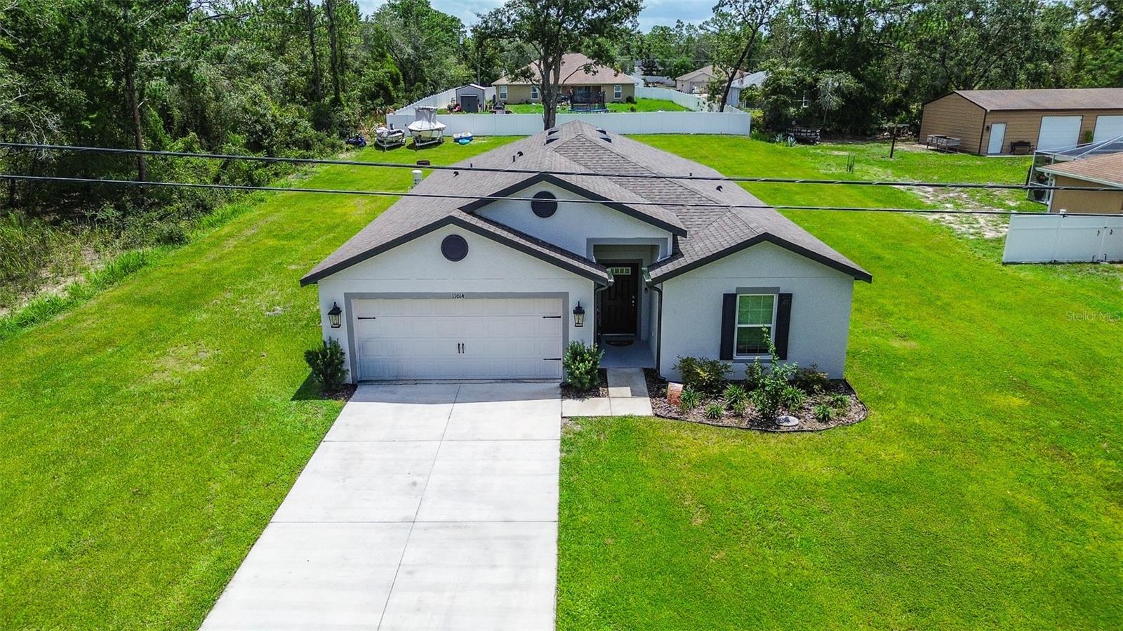 You can’t find another 5 BEDROOM, or 3 FULL BATHROOM home for this price!! Welcome to Royal Highlands—where the freedom of country living meets modern comfort. LIKE NEW BUILT IN 2023 - NEW ROOF, NEW HVAC system, NEW KITCHEN & BATHS, NEW ENERGY EFFICIENT WINDOWS, & NEW LUXURY VINYL PLANK FLOORING in main living areas. Situated on a generous ½ ACRE LOT — perfect for kids, pets, and outdoor entertaining. No HOA, no CDD fees, NO FLOOD ZONE. NO HOA or Deed restrictions so Bring the toys and leave the rules behind! Private 1/2 acre lot with zero HOA restrictions. Whether you have a boat, a trailer, or just a love for wide-open spaces, this is the one. Offers 2,000 square feet of bright, open concept living space featuring gorgeous granite kitchen, and durable floors. The home opens into a spacious family room seamlessly connected to the dinette area and kitchen, creating the perfect setting for entertaining and gathering. The kitchen features a center island with breakfast bar perfect for everyday living and gatherings, corner closet pantry, abundant WHITE SHAKER cabinetry, generous GRANITE COUNTERTOPS and SS appliances, as well as a cozy breakfast nook. The primary suite offers a private retreat including an Ensuite bath with dual sinks, tiled walk-in shower, and a spacious walk-in closet. You will also find the 2nd,3rd, 4th and 5th BEDROOMS and the 2nd and 3rd BATHROOMS, providing comfort and privacy for family or guests. All 3 BATHROOMS feature SHAKER CABINETS & GRANITE COUNTERS. The large number of bedrooms provides flexibility for family, guests, or a home office. An inside laundry room adds convenience. Additional features include a TWO-CAR GARAGE, a LONG EXTENDED DRIVEWAY and energy-efficient construction. Step outside to the covered back porch and you’ll find one of the property’s biggest advantages. The large backyard fenced along the back provides space to spread out, entertain, or simply enjoy the quiet surroundings. With nearly half an acre, there’s room for gardening, pets, outdoor games, or even chickens and rabbits. The expansive lot offers endless possibilities for outdoor living and the freedom and lifestyle you’ve been looking for. Enjoy living in the heart of Florida’s Nature Coast. Located in the highly sought-after and rapidly growing Royal Highlands of Weeki Wachee, this home puts you minutes from some of Florida’s most treasured natural attractions. Enjoy kayaking and crystal-clear waters at the Weeki Wachee Springs State Park, unforgettable manatee encounters at Homosassa Springs State Park, and endless outdoor adventures nearby at Chassahowitzka State Park. Nature lovers will feel right at home while still enjoying the convenience of a growing community. Enjoy local trails, Gulf Coast beaches, and everyday shopping and dining, the location offers both convenience and access to Florida’s outdoor lifestyle. Conveniently located just minutes from shopping, dining, medical facilities, and only 15 minutes to the Suncoast Parkway for an easy commute to Tampa, you’re perfectly positioned for both work and play. This is a chance to make a MOVE-IN READY home of newer construction and make it your own.