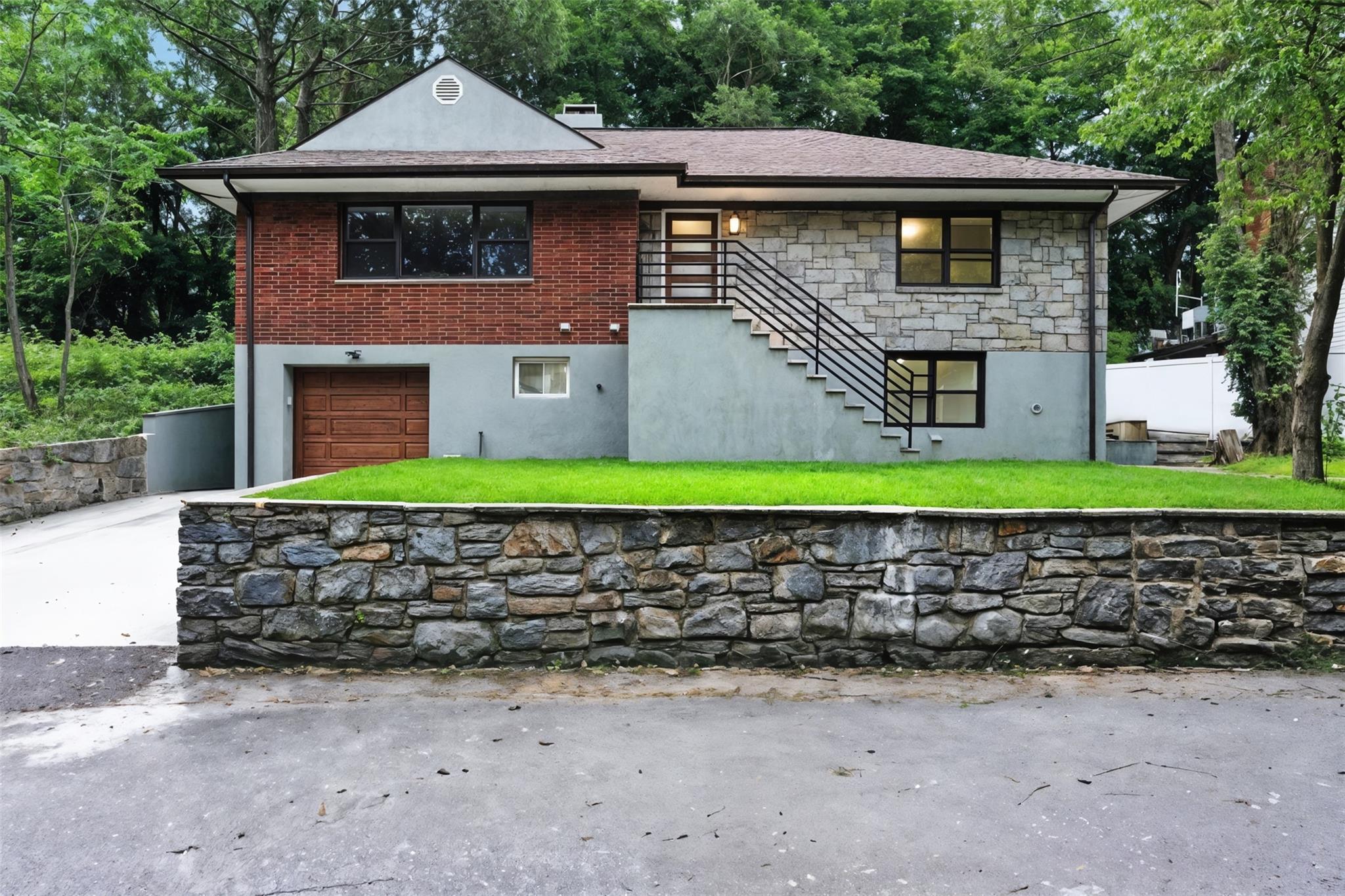 **Exquisite, Fully Restored Single-Family Home in Yonkers – Ideal for Large Families**

Welcome to this magnificent, fully restored single-family home spanning an impressive square footage, ideally located in desirable Yonkers, NY. This residence has undergone a meticulous, no-expense-spared renovation, showcasing state-of-the-art materials and craftsmanship throughout.

Designed with comfort and functionality in mind, the walk-in level offers an expansive large family room, perfect for gatherings and relaxation. This level also features a substantial versatile room, a spacious full bathroom, and a large, dedicated laundry room, providing ultimate convenience. A one-car garage and a generously sized driveway ensure ample parking for multiple vehicles.

The heart of this home is its brand-new, gourmet kitchen, boasting contemporary design and top-of-the-line appliances. With a total of three full, brand-new, state-of-the-art bathrooms, every detail has been carefully considered for luxury and comfort.

The grand master suite is a true sanctuary, featuring its own private full bathroom and three large walk-in closets, offering an abundance of storage. For peace of mind, the entire house has been upgraded with new wiring and plumbing, all meticulously completed to current code standards.

This spacious and thoughtfully designed home is truly ideal for a large family seeking modern amenities and ample living space. Its prime Yonkers location offers unparalleled convenience, with close proximity to all major transportation links and highways, ensuring a quick and effortless commute to New York City. This is a rare opportunity to own a turnkey, luxurious home in a fantastic location.