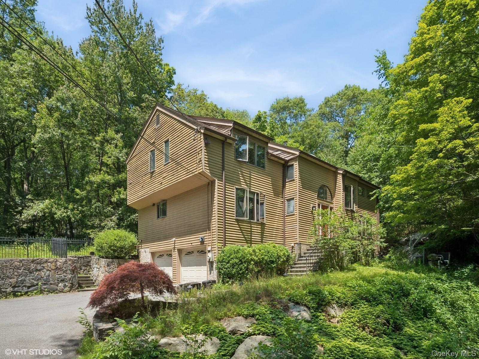 Tucked away on a quiet, wooded lane, this contemporary retreat is all about the setting - private, peaceful, and naturally dramatic. Set against a backdrop of exposed rock formations and mature trees, the backyard is a true sanctuary. Whether you're entertaining on the expansive deck, relaxing in the in-ground pool and jacuzzi, or enjoying a quiet morning coffee surrounded by nature, this outdoor space delivers. Inside, the home’s contemporary architecture shines. A two-story living room anchored by a striking floor-to-ceiling stone fireplace creates an open and airy focal point, flooded with natural light from skylights and oversized windows. The main floor flows with flexibility, offering space for everyday living and effortless entertaining. The primary suite includes its own bath and walk-in closet, while the finished lower level offers additional rooms for guests, work, or play. Located in the Katonah-Lewisboro School District — with Meadow Pond Elementary nearby — this home is also just minutes from some of the area’s best outdoor family destinations. Onatru Farm Park: Trails, sports fields, and open space host everything from everyday recreation to community events like the Fine Day Fair. Wolf Conservation Center: A unique wildlife preserve offering educational programs and family-friendly experiences year-round. Muscoot Farm (Katonah): A working farm with seasonal activities and animals, perfect for weekend family outings. Ridgefield Rail Trail: A scenic 2.3-mile walking and biking path just across the CT border. Enjoy everyday essentials and boutique shopping in South Salem and Ridgefield, CT, both a short drive away. For commuters, the location offers quick access to Route 35, I-684, and the Saw Mill Parkway, plus nearby Metro-North stations in Katonah or Ridgefield. If you’ve been searching for peace, privacy, and an exceptional outdoor setting, this is it!