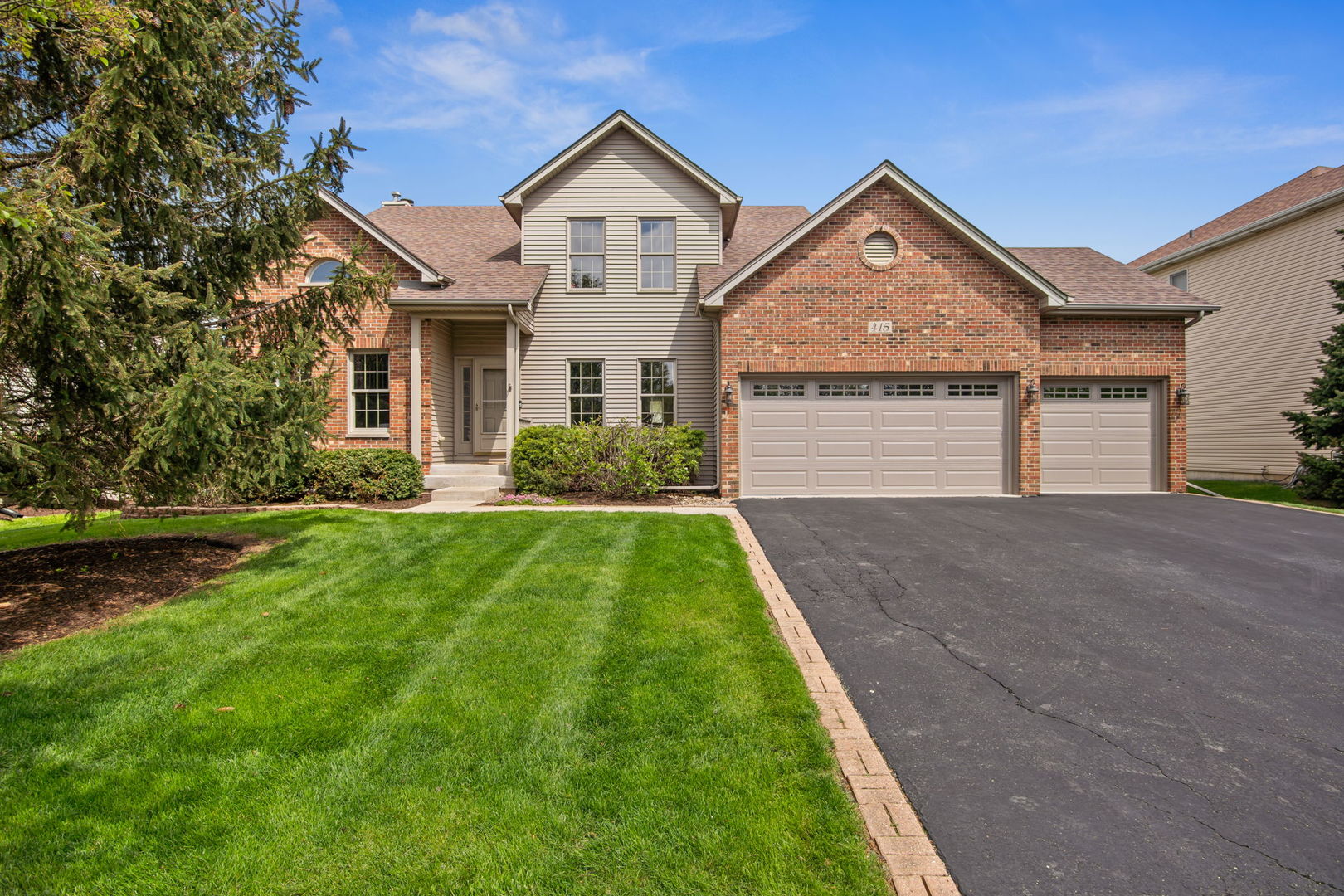 Located on a quiet street in the sought-after Deerpath Creek neighborhood of Oswego, this beautifully maintained 4 bedroom, 3.5 bath brick and vinyl two story offers space, style and an unbeatable setting just steps from parks, trails and nature preserves. The landscaped lot is built for outdoor living with a brick paver patio, gazebo and maintenance-free Trex deck, while the 3 car garage stands out with an epoxy sealed floor and 60A circuit for EV charging. Inside, a dramatic 2 story foyer opens to a stunning 2 story vaulted living room, complemented by hardwood flooring throughout most of the main level, a formal dining room with butler pantry, and a warm, inviting family room featuring a bay window and floor-to-ceiling masonry fireplace with gas logs. The eat-in kitchen is designed for both everyday living and entertaining with quartz countertops, stainless steel appliances, breakfast bar and easy access to the butler pantry, plus the added convenience of first floor laundry. Upstairs, the spacious primary suite impresses with a cathedral ceiling, walk-in closet and a deluxe private bath with double bowl vanity, whirlpool tub and separate shower. The full finished basement expands your living space with a great room including a 4K projector, game room, bar area, exercise area and full bath, perfect for entertaining or relaxing at home. Major updates include new carpet in April 2026, new luxury vinyl plank flooring in the basement, new garage doors in 2025, roof in 2019 and HVAC in 2020, making this home truly move-in ready inside and out.
