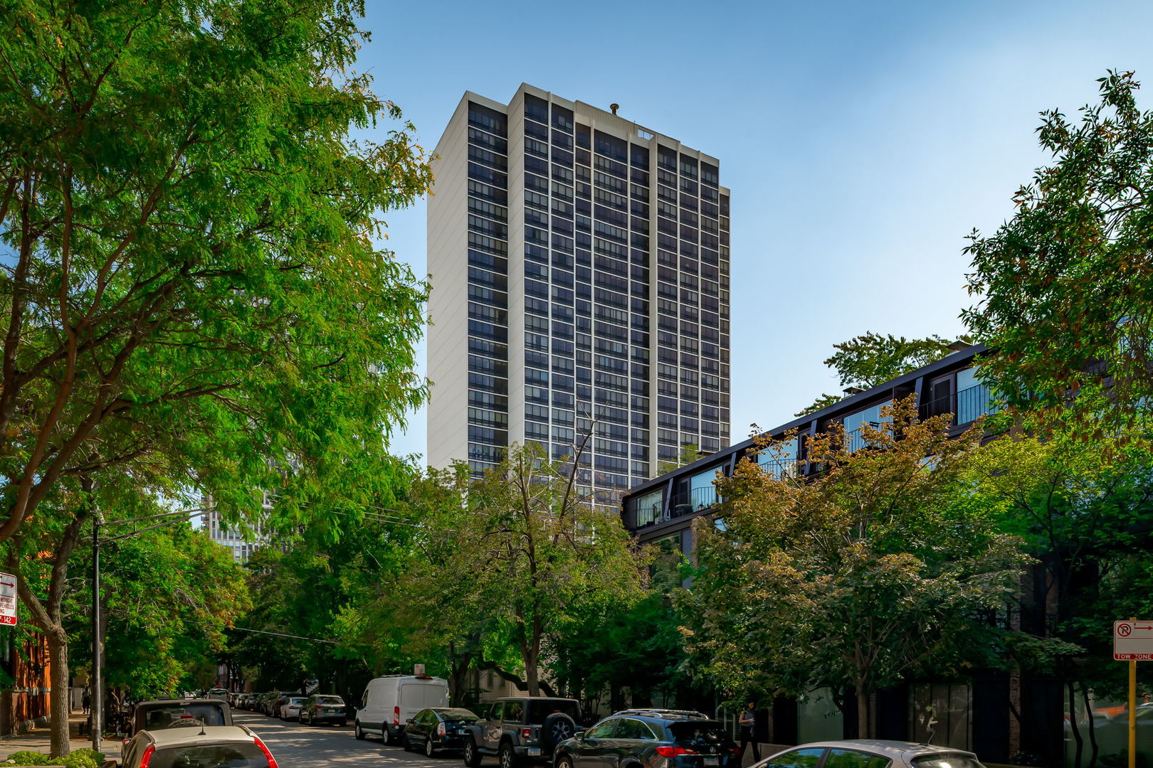 Discover a rare gem in vibrant Old Town - a sun-drenched, east-facing corner unit offering two bedrooms and two bathrooms, complete with stunning California Wide Plank floors and a modern kitchen. This inviting home features a spacious living room bathed in natural light, with floor-to-ceiling windows that open to an expansive private balcony, perfect for morning coffee or evening relaxation.  The generous primary ensuite bedroom is a true sanctuary, boasting a massive closet and breathtaking west-facing sunset views. Enjoy the convenience of a full-amenity building, including a 24/7 doorman, onsite management and maintenance, a heated outdoor pool with sundeck, sauna, hospitality room, bike racks, storage, onsite rental parking, and a dry cleaner. Heat and A/C are included in the HOA fees, ensuring comfort and value. Steps from Lincoln Park Zoo, pristine beaches, Second City, trendy shops, boutiques, restaurants, fitness centers, and a 24-hour Starbucks, this location offers the best of urban living. Investor-friendly and move-in ready, this Old Town treasure is your perfect Chicago home!