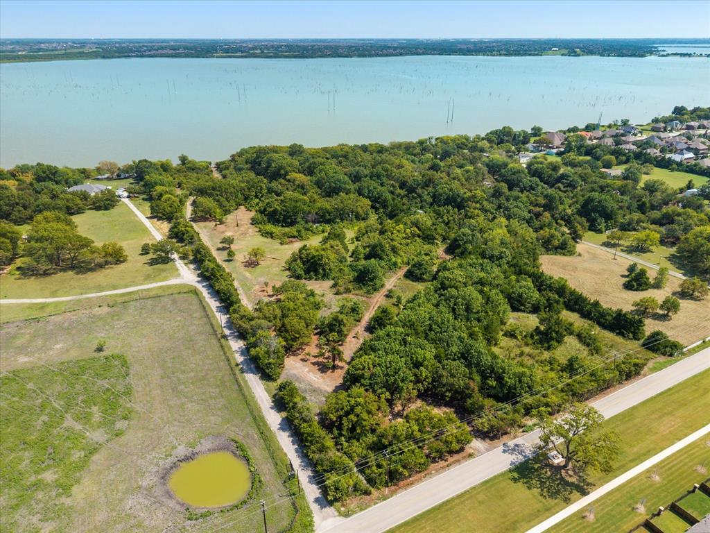 Platinum Land Group is pleased to present this exceptional 10-acre lakefront tract in Wylie, offering refined country living with unmatched freedom and flexibility. Located outside city limits within the ETJ, this property features no HOA and no deed restrictions, allowing you to bring your business and livestock while building your dream home.With convenient proximity to Highway 78, Highway 66, and President George Bush Turnpike—yet boasting frontage on Lake Ray Hubbard—the property offers a rare blend of accessibility and true waterfront living.Water is provided by East Fork Special Utility District, and a survey is available. The acreage also offers flexible interim use for potential commercial or residential purposes, making it ideal for personal use, business operations, or investment.Whether you envision a private lakefront estate, workshop, space for animals, or a multi-use property, this tract delivers the space and freedom to create something exceptional.  (Seller financing not available)