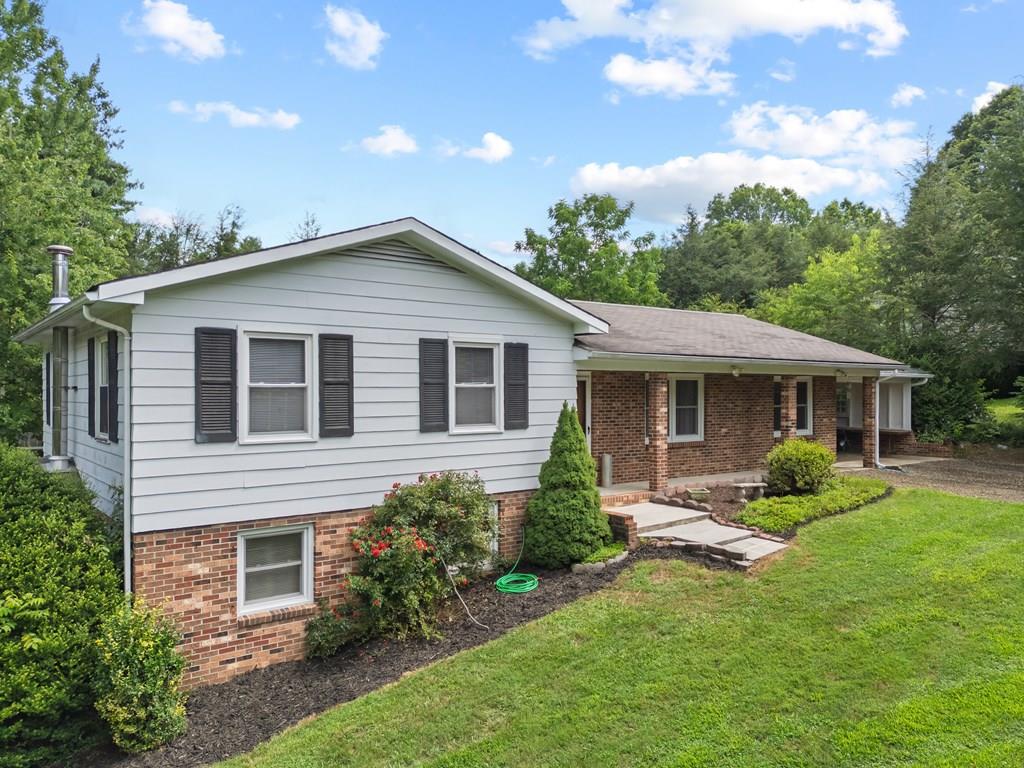 Welcome to this spacious 4-bedroom, 3-bath split foyer ranch home located just outside of Independence, VA. Perfectly suited for a growing family, this home offers a generous layout with a large kitchen ideal for cooking and gathering, a comfortable living room, and a cozy den for relaxing or entertaining. Enjoy the convenience of an attached carport and the comfort of three full bathrooms, plenty of space for everyone. Featuring central A/C and multiple heating sources to keep your family comfortable. Sitting on nearly an acre of land, the property provides room to play, garden, or simply enjoy the peaceful surroundings. Located just minutes from town, schools, and local amenities, you'll also love the close proximity to the New River, offering easy access to fishing, kayaking, and outdoor adventure. Having been steadily updated and maintained, this home combines comfort, space, and location. Don't miss this opportunity to make it your own!