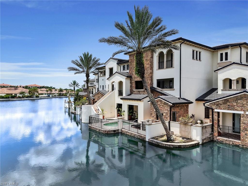 Welcome to this stunning Italian two story villa pool home in the highly coveted Talis Park community in Naples, FL just a stroll away from world-class amenities. Located in the Toscana neighborhood, this former model home boasts nearly 3,500 square feet of living space, including 3 bedrooms, a den/office, and 4 ½ baths. Inside, you will find beautiful ceiling details, slate and hardwood floors, a private elevator, four wet bars, an abundance of storage, along with a chef's dream gourmet kitchen with quartz countertops, extended 42-inch cabinetry, & Viking appliances. There are different areas of the home to entertain while maintaining an open concept feel. The expansive owner's suite provides a luxurious escape and spa-like bathroom. The outdoor space includes a heated pool and spa overlooking a tranquil lake, complemented by a full outdoor kitchen and a pool bathroom. The property features a new 2025 roof for peace of mind. Talis Park residents enjoy one of the country's top-rated golf courses designed by Pete Dye & Greg Norman, along with tennis, pickleball, a state-of-the-art clubhouse, a dog park, and a full-service spa—all just minutes from Naples' premier beaches, dining, and shopping.