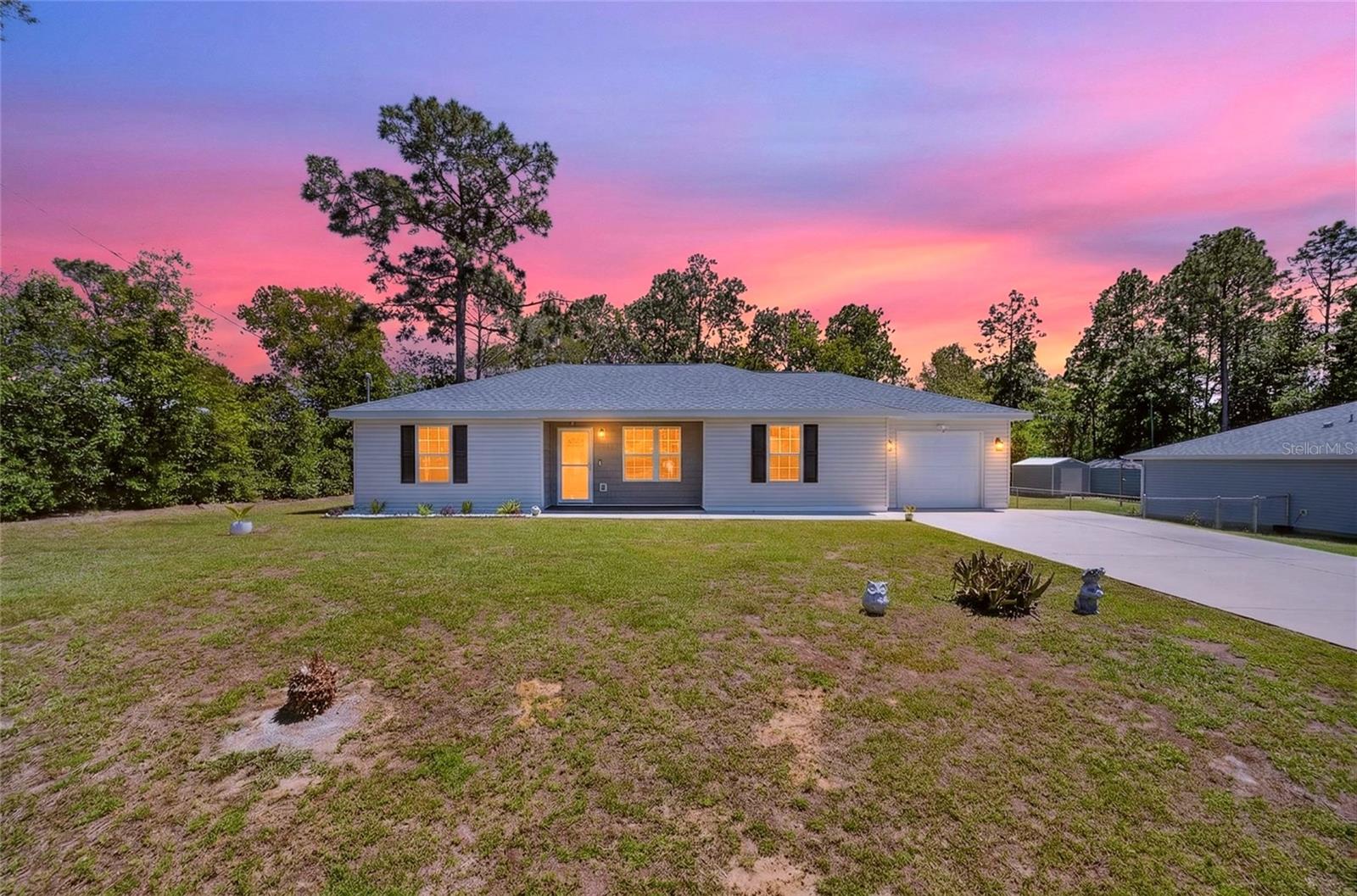 Beautifully updated 3-bedroom, 2-bath home with a 1-car garage and EXTENDED DRIVEWAY—offering both comfort and convenience! This MOVE-IN READY property was FRESHLY PAINTED INSIDE AND OUT! The home features stylish upgrades throughout. Step inside to find TILE FLOORING THROUGHOUT the entire home—NO CARPET, creating a clean, MODERN, AND LOW-MAINTENANCE LIVING SPACE. The kitchen is equipped with GRANITE COUNTERTOPS, stainless steel appliances, and includes a washer and dryer for added convenience. ELEGANT LIGHTING FIXTURES AND UPGRADED FEATURES add a touch of sophistication in every room. The desirable split-bedroom floor plan provides privacy, while the spacious layout offers flexibility for families or guests. Outside, enjoy a FULLY FENCED BACKYARD WITH A VINYL PRIVACY FENCE, a PATIO perfect for relaxing or entertaining, and a LARGE SHED for additional storage. Additional highlights include a power pole in the front yard for enhanced exterior lighting and a Ring doorbell with built-in spotlights for added security and peace of mind. Ideally located less than 2 miles from major retail and grocery stores, restaurants, golf courses, pharmacies, and main roadways, this home combines modern upgrades with an unbeatable location. Don’t miss this incredible opportunity—schedule your showing today!