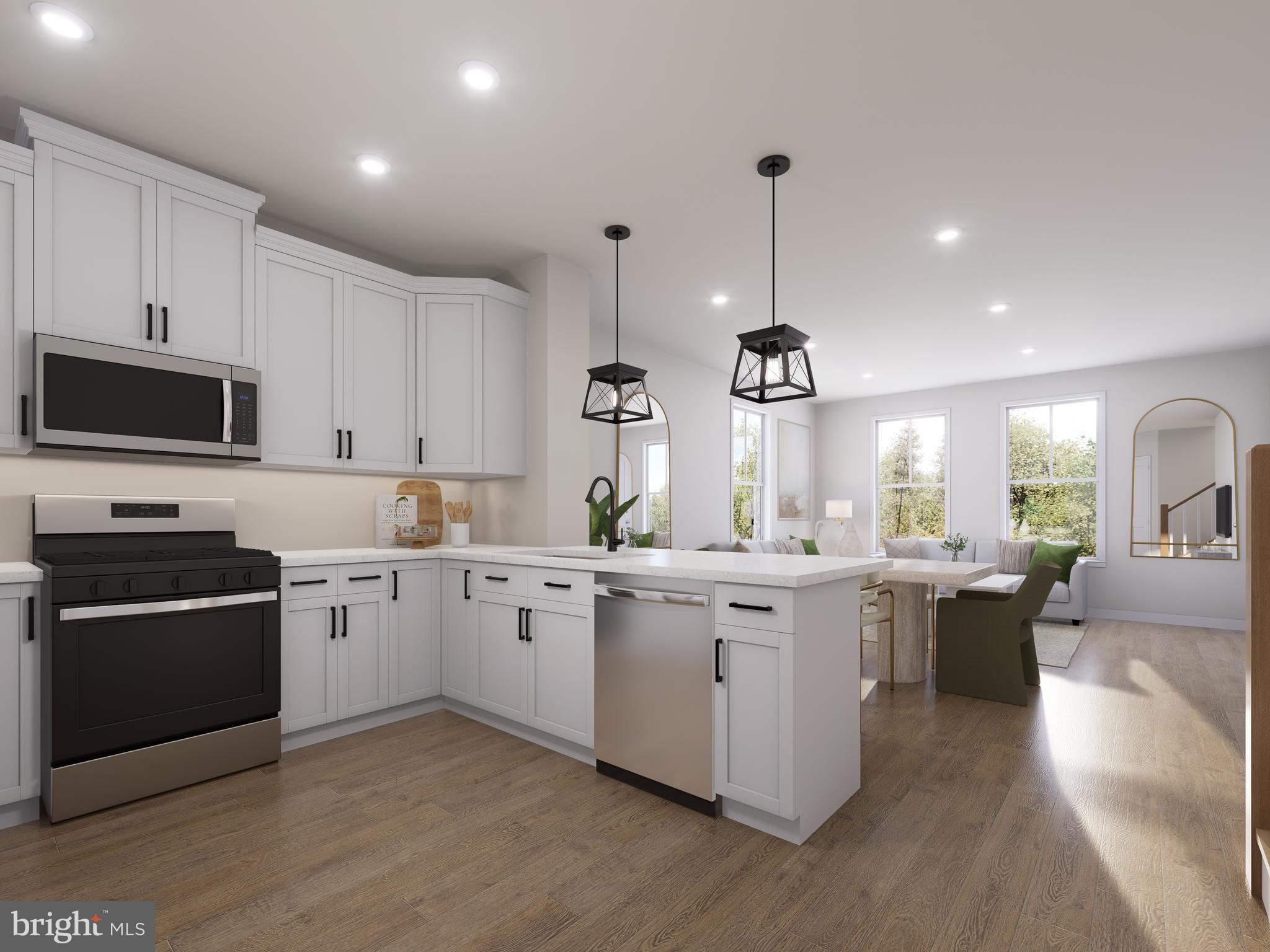 **Up to 30K IN FLEX CASH WITH USE OF APPROVED LENDER AND TITLE! Lower your price, cover your closing costs, or buy your rate down**End of year delivery. Discover the Rosslyn floor plan, a perfect blend of luxury, comfort, and functionality designed for modern living. Located in the sought-after One Loudoun community, this low-maintenance, 2-level condo offers both a welcoming front entrance and private access through the rear 1-car garage. The main level is thoughtfully designed with a rear chef's kitchen with stainless upgraded GE appliances including an exposed hood and microwave on wall, featuring a spacious walk-in pantry and peninsula island, providing open views to the expansive great room. A conveniently located powder room adds to the ease and comfort of this space. Upstairs, the luxurious primary suite stands out with two separate walk-in closets and an ensuite bathroom that includes a dual sink vanity, walk-in shower with a seat, and private water closet. The second level also includes two generously sized secondary bedrooms, a full bathroom with a dual sink vanity, a conveniently placed laundry area which includes a full size washer/dryer, and a large walk-in mechanical room to meet all your storage needs. This home includes a charming deck off the secondary bedroom and truly combines modern design with upscale features, making it the perfect space for any lifestyle. *Photos may not be of actual home. Photos may be of similar home/floorplan if home is under construction or if this is a base price listing.