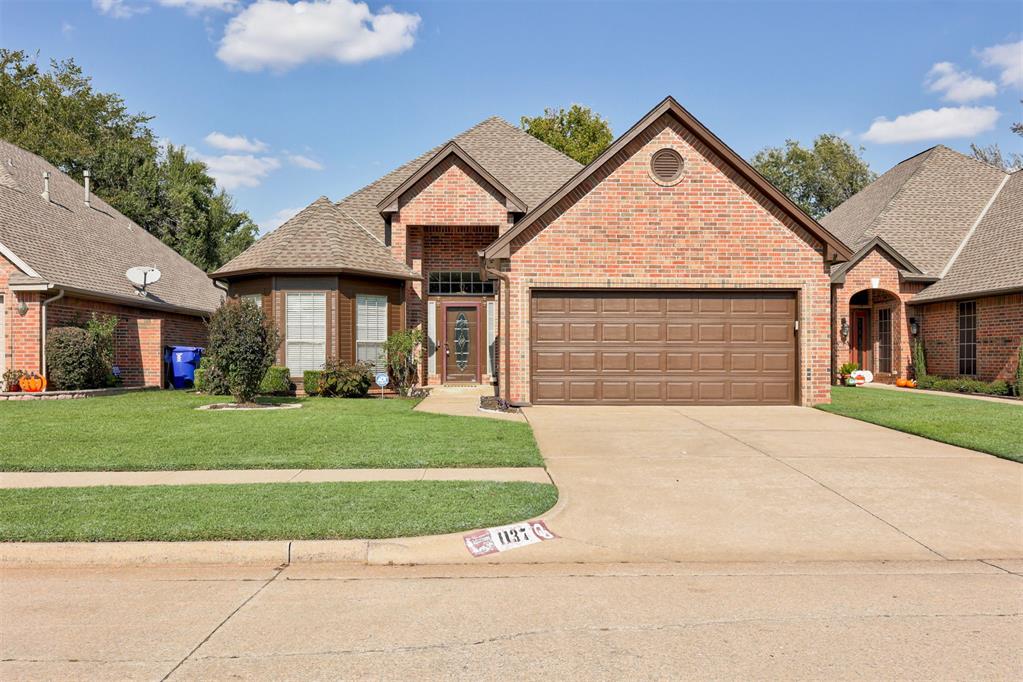 Welcome home to low-maintenance comfort and everyday convenience, just 1.5 miles from OU and minutes from The Trails Golf Club.

Tucked into the peaceful River Chase community, this single level home blends spacious living with practical ease. Whether you’re heading to campus, commuting via I-35, or enjoying Norman’s local coffee shops and parks, you’re perfectly positioned to experience it all.

The neighborhood itself offers meandering walking trails around a serene pond, along with access to a community clubhouse and swimming pool, perfect for staying active or enjoying quiet afternoons close to home.

The open floor plan is anchored by a striking double sided fireplace that connects the living room and den, creating a cozy, flexible layout ideal for relaxing or hosting guests. The kitchen features sleek black granite countertops, ample storage, and a sunny breakfast nook with skylight, a perfect start to any morning.

The primary suite offers a peaceful retreat with a walk-in closet, soaking tub, dual vanities, and a separate shower. An additional bedroom and dedicated office or flex space add even more function. A laundry room, two car garage, and above ground storm shelter add convenience and peace of mind.

Step outside to a covered patio and a fenced and landscaped backyard, perfect for quiet evenings, a garden, or weekend barbecues.

Ready to explore? Take the 3D tour, video walkthrough, or interactive floor plan, and see how this conveniently located, well-designed home fits your lifestyle.

HOA includes pool, walking trails, and rec facility.