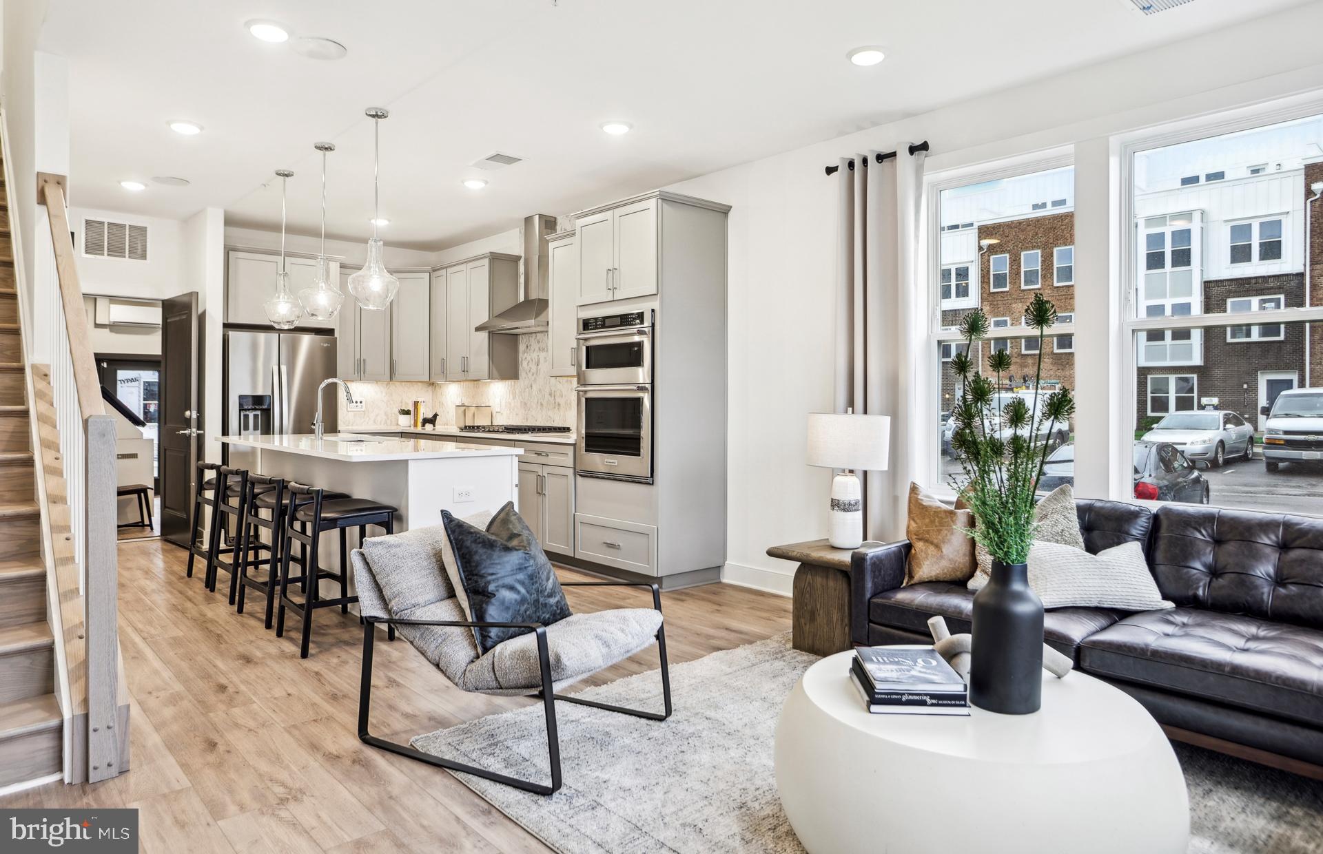 NEW CONSTRUCTION- $25,000 in Closing Costs tied with the use of Pulte Mortgage Corporation.This Lower Level Lawrence condo offers 3 Bedrooms, 2.5 Bathrooms, a 1-Car Garage & a 1-Car Driveway. As you enter the open floorplan home, the Gathering room has 3 windows. The Gourmet Kitchen is spacious and is complete with a large island with Quartz Countertops/ Cascade Island and White Cabinets. This home includes KitchenAid Appliances with a 5-Burner Gas Cooktop, Chimney Hood Vent and a Microwave/Oven Combination. The large walk-in pantry is very convenient as you enter the home from the garage. The Owner’s Suite is spacious boasting sizable dual walk-in closets. The Owner's Bath has a dual vanity sinks, a walk-in shower with a seat, a separate water closet, and a linen closet.  Off the Owner’s Suite, is a 6’ x 20’ Balcony to enjoy a morning coffee or an evening cocktail.  A convenient walk-in laundry room and a linen closet to complete the second floor. There is 9" Luxury Vinyl Plank(LVP) on the 1st Floor and upper Hallway.  Oak stairs from first to second floor is included.