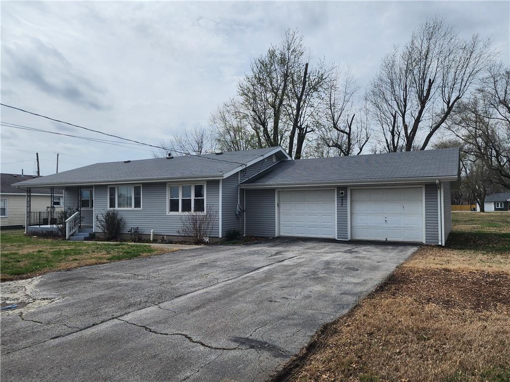 "Looking for square footage and a great location? This 2BR, 1.5BA ranch delivers. Featuring extra-large room sizes and a versatile 21x13 flex space, this floor plan adapts to your needs. The kitchen has been refreshed with painted cabinetry and leads directly to the laundry area and bonus room. Outside, you’ll find a deep 2-car garage and plenty of yard space on this oversized lot, plus a 20x7 covered front porch. Located near Lamar City Lake, this home combines a peaceful setting with incredible bones. Bring your ideas and move right in!" Buyer to verify square footage, taxes & school district.