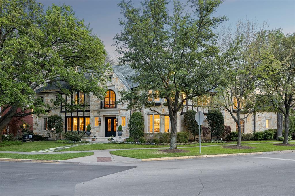 A truly rare opportunity to own an extraordinary 160 x 182 estate lot on a premier oversized corner in one of the most coveted locations in University Park. This one-owner residence, designed by architect Richard Drummond Davis and custom built by Jim Shaw in 2003, showcases timeless architecture, refined craftsmanship, and exceptional scale throughout. A grand two-story entry featuring custom steel front and rear doors, oversized moldings, elegant formal living and dining spaces and a well-appointed butler’s pantry enhance the home’s entertaining appeal. Thoughtfully updated in 2021, the kitchen blends beauty and function with quartzite countertops, decorative tile, a generous island with seating, storage, a Wolf range, double ovens, Miele dishwasher, and SubZero refrigerator-freezer. Dual sinks enhance functionality, the breakfast area-overlooks the private backyard.The family room is designed for both comfort and entertaining, features a fireplace with gas logs,fully equipped wet bar. The space opens effortlessly to the covered outdoor living area, with a built-in grill, refrigerator, and an expansive turfed backyard with resort-style pool and spa, creating a true backyard retreat. The home offers a highly desirable and functional layout, with a private downstairs guest suite, ensuite bath, walk-in shower. The study is richly appointed with custom built-ins, a coffered ceiling, gas-wood-burning fireplace, and French doors that open to the backyard, offering a quiet and refined workspace. Upstairs includes a spacious game room with balcony, a media room, and generously sized secondary bedrooms with ensuite baths. The primary suite is a serene retreat with vaulted ceilings, backyard views, and a flexible adjoining space. The luxurious bath includes heated floors, dual vanities, soaking tub, and separate closets. Ideally located near shops,dining,parks and top-rated schools, this home offers exceptional quality, space, and lifestyle.