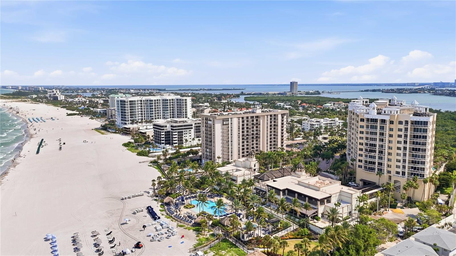 Wake up to the beauty of Lido Key from this 12th-floor Gulf-front residence at 1212 Benjamin Franklin Drive, Unit 1205. Elevated above the shoreline, this inviting condo captures expansive views of the Gulf of Mexico and offers a relaxed coastal setting just moments from everything Sarasota has to offer. The light-filled living and dining areas open to a private balcony where Gulf breezes and colorful sunsets create the perfect backdrop for morning coffee or an evening glass of wine. The kitchen features stone countertops, abundant cabinetry, and plenty of workspace, while the spacious bedroom offers generous closet space and an updated bath. Enjoy the convenience of true beachfront living with direct access to the sand, a heated seaside pool, fitness center, club and meeting areas, secure lobby, on-site management, elevators, and assigned covered parking. The building provides the ease of condominium living while placing the Gulf just outside your door. Located on desirable Lido Key, the residence is only minutes from the restaurants, boutiques, and entertainment of St. Armands Circle, with downtown Sarasota's dining, theaters, galleries, and cultural attractions just a short drive away.  Ideal as a primary residence, seasonal getaway, or easy lock-and-leave coastal retreat, this 12th-floor condo offers an exceptional opportunity to enjoy the Lido Key lifestyle with beautiful Gulf views, beachfront amenities, and one of Sarasota's most sought-after locations.