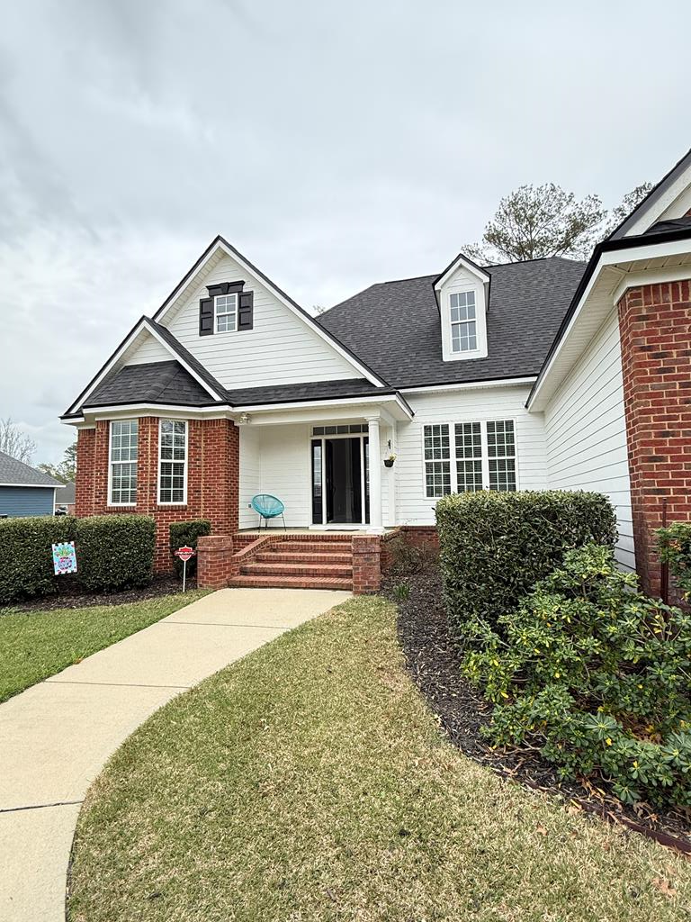 131 Pheasant Ridge | Thomasville, GA 31792 4 Bedrooms | 2 Baths | 2,255 Sq Ft | Approx.  Acre | New Roof Jan 2026  Stately brick home in Summer Glen at Shallow Brook, one of Thomasville's most established and desirable residential communities — offering larger homesites, walkable streets, and a peaceful lake-centered setting just minutes from Historic Downtown Thomasville.  Positioned on approximately half an acre overlooking the community lake (water view, not lakefront), this 4-bedroom, 2-bath residence offers 2,255 square feet with a functional split floor plan designed for both entertaining and everyday living.  Soaring 14-foot ceilings, architectural columns, judge's paneling, and marble flooring accents create a sense of presence and scale. The open living area flows seamlessly into the kitchen with stainless steel appliances and generous prep space.  The primary suite features a trey ceiling and spa-style bath with dual vanities, jetted soaking tub, oversized travertine shower, and walk-in closet. Guest bedrooms are well-sized, and the secondary bath includes granite countertops and dual sinks.  Exterior highlights include:  Fenced backyard  Covered patio for outdoor gatherings  Storage building  Automatic sprinkler system  2-car garage + additional parking pad  Major value update: Brand-new roof being installed January 2026 — price remains unchanged.  With nearby homes selling in the $600s and lakefront properties approaching $700K+, this home represents an opportunity to secure space, location, and long-term value within Summer Glen at Shallow Brook.