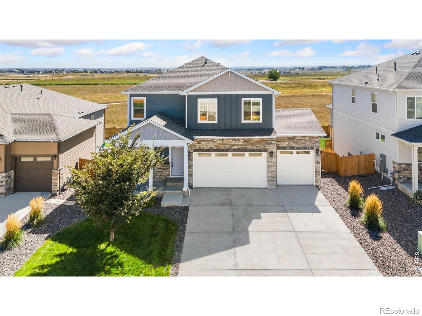 ASSUMABLE FHA LOAN WITH LOW INTEREST RATE!!!!!! This refreshed two-story home backs to open space and offers a comfortable layout, plenty of room to grow, and a setting that makes the most of the Colorado landscape. Fresh updates from top to bottom include upgraded flooring and new light fixtures, giving the interior a clean, modern feel. The foyer opens into a bright and open living area where a refinished corner stone fireplace creates a warm focal point, framed by large windows that bring in natural light. The kitchen showcases upgraded stainless steel appliances paired with quartz countertops, a pantry, and a large center island with bar seating and abundant prep space. A bonus flex area near the front entrance provides a versatile setup for a home office, study, or hobby studio. All four bedrooms are located on the upper level alongside a dedicated laundry room that streamlines daily chores. The spacious primary suite features an en-suite bathroom and a walk-in closet. The unfinished basement offers incredible potential for future customization, with a bathroom rough-in already in place. The fenced backyard backs directly toward open greenbelt acreage and features a raised deck plus an included hot tub, offering an inviting spot to relax with farm and mountain views as your beautiful backdrop. An oversized 3-car garage boasts high ceilings for added vehicle, gear, or workshop capacity. Neighborhood walking paths and parks invite outdoor recreation, while easy access to I-25, Longmont, and DIA provides swift travel across the region!
