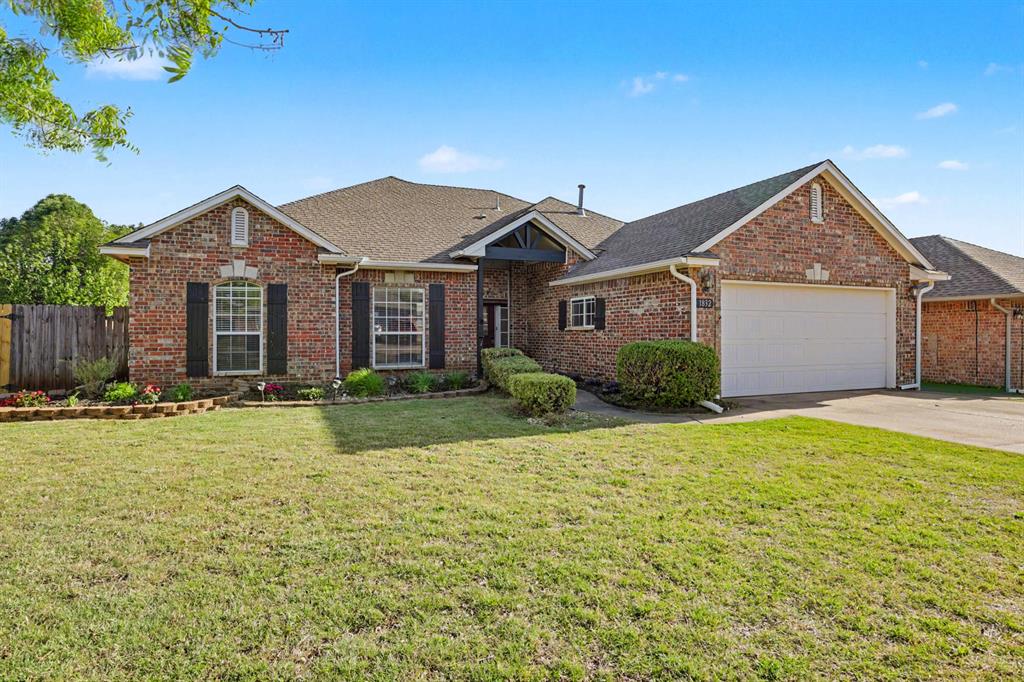 Welcome to 1832 Camden Way! This beautiful home checks all the boxes: style, space, and location. Featuring three spacious bedrooms plus a dedicated office, this home offers the flexibility today's lifestyle demands. Step inside to find beautiful wood flooring throughout the main living area. The heart of the home is a stunning two-sided brick fireplace, creating a warm, architectural focal point that connects the main living room to a versatile flex space. Whether you envision a cozy sitting nook or 2nd living area, this additional living space offers endless possibilities. Custom built-in shelving adds both style and functionality to the living space, offering the perfect place to showcase decor, books,  and personal touches. The kitchen is thoughtfully designed with ample cabinetry and generous storage, making everyday living and entertaining effortless. Enjoy the benefits of community amenities, including a pool and recreation facility, all while being conveniently located just off Broadway Extension (I-235) with easy access to shopping, dining, and all that Edmond has to offer.
