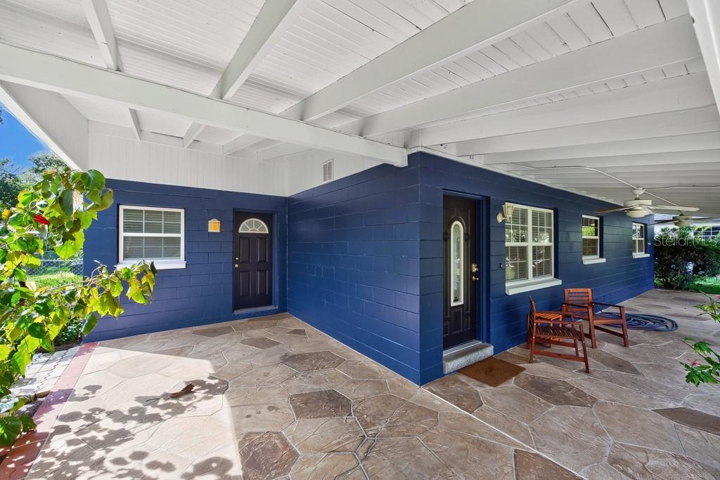 Virtually Staged. Rare Pondside Setting, Flexible Living and Endless Possibilities in Forest Hills!Enjoy peaceful pond views from the covered front porch, a garden-filled backyard, and a distinctive setting with included land across Pond Lake Drive extending to the waters of Lake Sophia. Located in Tampa's Forest Hills neighborhood, 1708 Pond Lake Drive offers a unique blend of comfortable living, versatile bonus space, and valuable updates—with exciting possibilities to make the property your own.This single-story home features 3 bedrooms, 2 bathrooms, and 1,907 square feet of living space on approximately 0.36 acres. Inside, the open living and dining area creates a welcoming atmosphere for entertaining and everyday gatherings, while a separate family room provides additional space for movie nights, relaxing, or spending time with family and friends. The kitchen features warm wood-tone cabinetry, light-colored countertops, a convenient breakfast bar, and an adjoining dinette—creating a natural gathering spot for casual meals and conversation. Tile flooring and wood-look plank flooring in the bedrooms offer practical, easy-care appeal.The possibilities extend beyond the main home with a detached bonus building featuring electricity and water! Envision transforming this versatile space into an ADU with potential for additional income, a short-term rental, or a private retreat for multigenerational living. It could serve as a guest retreat, home office, creative studio, workshop, or hobby space, offering flexibility for work, creativity, and relaxation. Whether you're looking for extra living space, a place to work and create, or an opportunity to explore income-generating potential, this additional space offers flexibility to fit a variety of needs and lifestyles.Step outside to enjoy the garden and generous backyard, with room for outdoor entertaining, gardening, weekend projects, or simply unwinding at home. The covered two-car carport adds everyday convenience, while the pond views and property's setting near Lake Sophia contribute to its distinctive outdoor appeal.Major improvements add even more value, including the main home roof and detached-building roof (2022), electrical panel (2022), water heater (2022), A/C (2023), and a new septic pump. The interior was painted approximately three years ago, and documentation of improvements is available. No HOA or CDD is reported.Conveniently located in Tampa's Forest Hills neighborhood, this property offers access to USF, Downtown Tampa, shopping, dining, and golf. With its pondside setting, inviting living spaces, versatile detached bonus building, garden backyard, and important updates, this home presents an opportunity to enjoy a distinctive property with room to grow, create, and make it your own.Discover the charm. Explore the possibilities. Make 1708 Pond Lake Drive your next home!
