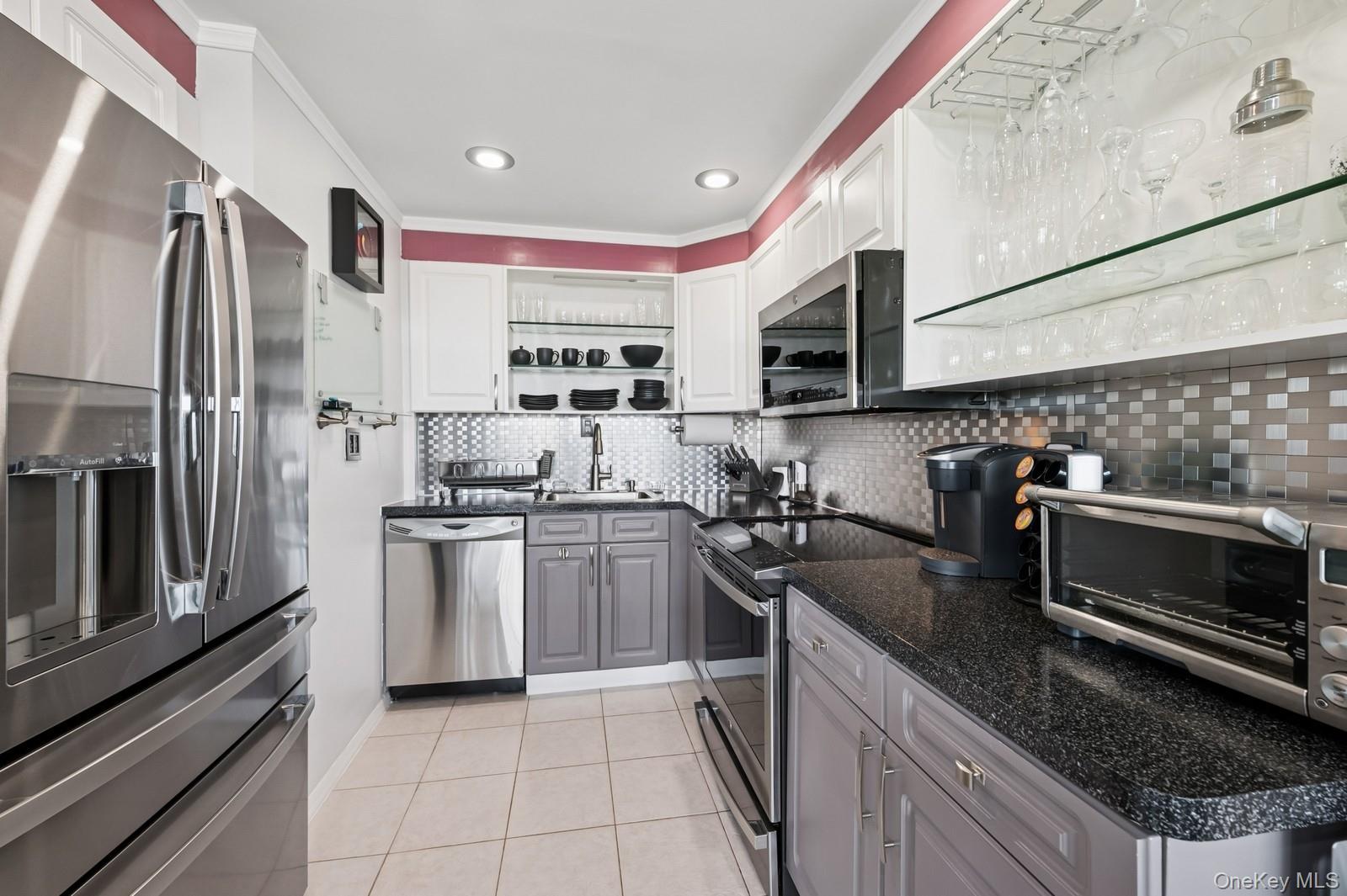 Move In Ready - 3BR, 1BTH - Modern, Custom And Designer Renovation Recently Completed Throughout The Entire Home. Emaculate And Very Well Mainatined. High Floor With Sliver Views Of The Water And Sunrise. Washer Or Dryer On Every Floor. Le Havre Amenities: 2 Outdoor Pools, 3 Tennis Courts, A Fitness Center, Club House/Restaurant, Playgrounds And A Park Like Setting.