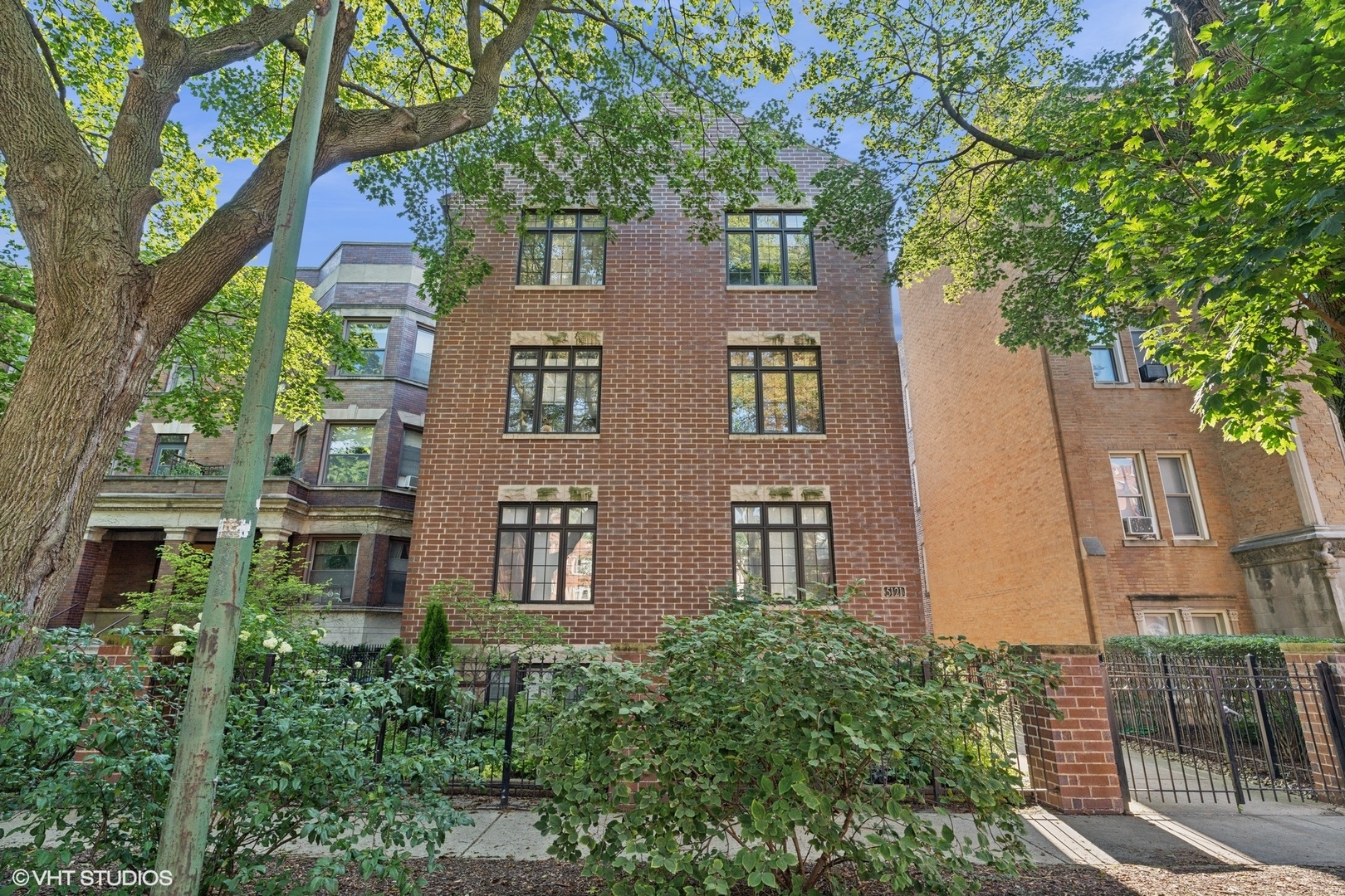 Airy and spacious duplex down with four bedrooms, three full baths, and parking for two cars in an intimate Hyde Park building. Open floor plan features living area with gas fireplace, large dining area, and stainless/granite kitchen. Two bedrooms and two full baths on the main level include a primary suite with luxury bath with whirlpool and separate shower. The main level laundry room with side-by-side washer dryer is conveniently located near the bedrooms. The lower level with volume ceilings adds a family room with workout area, two additional bedrooms, and a third full bath. Elevated finishes include hardwood floors on the main level, recessed lighting throughout, and  travertine baths. One garage parking spot and one exterior space are included. Self-managed building with just six units, this inviting home is wonderfully located near transportation, 53rd street shopping, and the University.