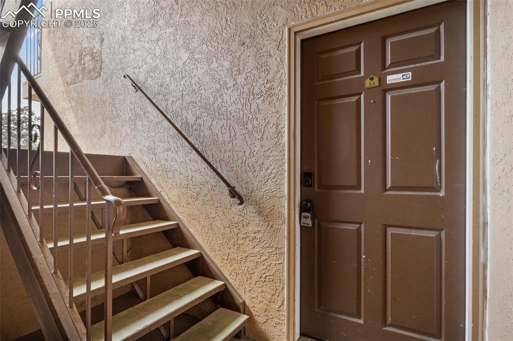 Newly Renovated 2-Bedroom Condo – Ideal Starter Home or Investment Opportunity!Welcome to this beautifully updated 2-bedroom, 1-bathroom condo offering comfort, convenience, and stunning views of Pikes Peak. Perfect for first-time buyers or savvy investors, this home combines modern finishes with a practical layout.Step inside to find fresh paint throughout, brand-new laminate flooring in the spacious bedrooms, hardwood floors in the bright and airy living room, and durable tile in the kitchen and entryway. The full bathroom features a tub/shower combo, ideal for relaxing after a long day.This unit includes one assigned parking space and access to a communal laundry room.  HOA Includes Heat, water, Insurance, maintenance of structure and lawn, Common utilities, Covenant enforcement, snow removal, and Trash!Don’t miss out on this move-in-ready gem with low-maintenance living and easy access to everything you need!