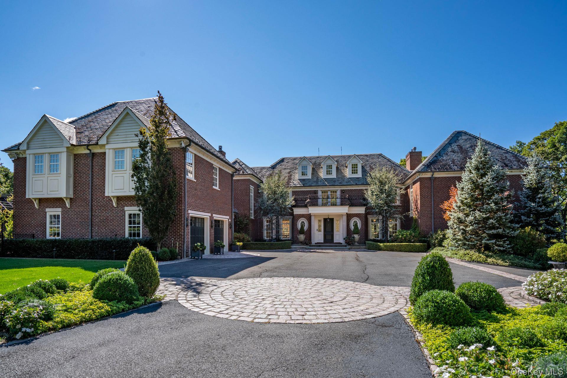 This Gated Majestic Brick Manor, features 6-bedroom, 6-bath, 3-powder rooms and sits at one of the highest points on Long Island surrounded by lush parkland and English gardens for the ultimate in serenity and privacy. This one-of-a-kind property has its own, FAA recognized, helipad which allows you the luxury to fly over traffic to NYC or the Hamptons with ease. This Estates sophisticated elegance depicts exquisite attention to every detail featured, from custom mill work, exotic quarter sawn wood floors, imported marble with everything covered from its energy efficient geo-thermal heating & cooling, radiant heat throughout, gourmet EIK, palatial principles-suite, expansive additional living quarters, 4 fireplaces, ornamental iron details with security system, heated driveway and much more. This home is truly an entertainer's paradise with in-ground heated pool & spa w/ salt system and waterfalls, starlit home theater, indoor squash & basketball court, gym, game room, and workshop ., Additional information: Green Features:Insulated Doors,Interior Features:Guest Quarters,Lr/Dr,Marble Bath