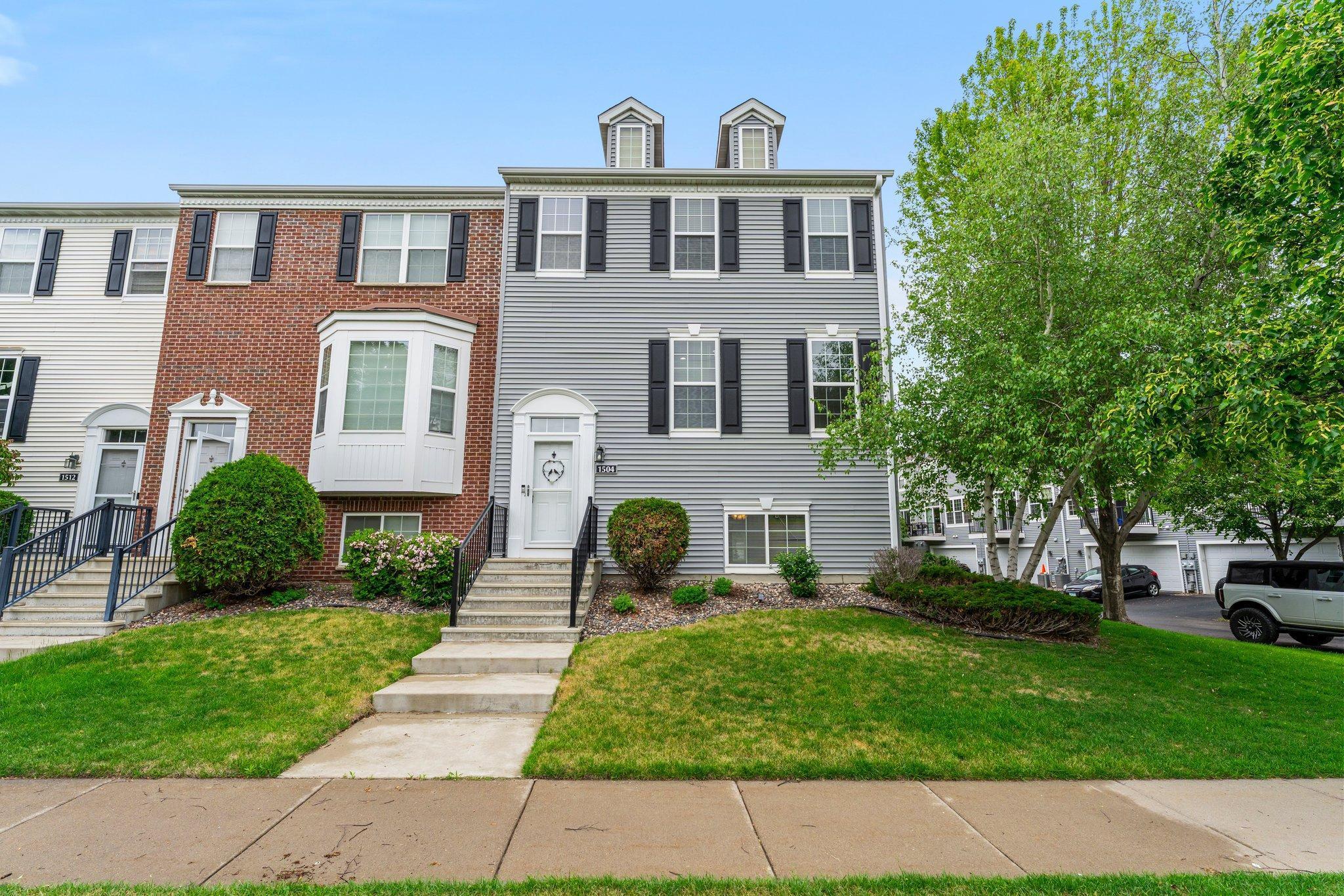 Welcome to this spacious end-unit townhome, offering 4 bedrooms, 4 bathrooms, and generous living space across multiple levels. Ideally located near Deans Lake and Canterbury Park, this home places you close to an array of shopping, dining, and entertainment options, all while providing easy access to major roads and highways for a streamlined commute.

As you step into the main level, you’re greeted by a sunlit living room. Large windows provide natural light, highlighting the beautiful accent wall that adds a touch of style and personality. A conveniently located hall closet and nearby ½ bathroom offer added practicality for guests and everyday use.

The open floor plan guides you into a charming dining area featuring timeless wood flooring, a statement light fixture, and a buffet counter with additional cabinetry—ideal for storing dishware or showcasing décor. A gas fireplace creates a warm, welcoming ambiance, making it the perfect space for entertaining.

The adjacent kitchen showcases matching wood flooring, stainless steel appliances (new in 2020), and a center island with breakfast bar seating and added storage. A tasteful tile backsplash complements the cabinetry, and sliding doors open to a maintenance-free 6x7 deck—perfect for sipping your morning coffee or relaxing with a good book.

Upstairs, you’ll find a true retreat in the oversized 23x13 primary suite. This bedroom features 12-foot ceilings, a ceiling fan for enhanced comfort, and multiple windows that bathe the space in natural light. A large 9x5 walk-in closet with custom built-in shelving offers ample storage and organization. The primary ensuite bath includes elegant tile flooring, a walk-in rain shower with tile surround, a separate soaking tub for relaxing, a double vanity, and a linen closet for convenient storage.

Two additional upper-level bedrooms are spacious and bright, each offering modern ceiling fans, closets with wire shelving, and soft carpeting. They are served by a stylish shared full bathroom with tiled floors and a combined tub/shower with tile surround.

On the lower level, you'll find the fourth bedroom, a versatile space perfect for use as a guest suite, home office, media room, or bonus living area. This room features durable LVP flooring, a ceiling fan, and peaceful views of the front yard. It also offers a private ¾ bathroom with a walk-in tiled shower and tile flooring—offering comfort and privacy for guests.

Also on the lower level is a designated laundry room with upper cabinetry for storage and a built-in hanging rod for laundry convenience. (Please note: washer and dryer are not included in the sale.) Access the heated two-car garage directly from the lower level. Recently upgraded with epoxy flooring (May 2025) and built-in cabinetry, this garage offers both comfort and function year-round—great for Minnesota winters.

This welcoming community features shared amenities including an outdoor pool, gazebo, and playground, offering plenty of opportunities to relax, socialize, and enjoy the outdoors. Many additional updates have been made over the years to provide modern comfort and peace of mind for many years to come—a full list is included in the Property Highlights.