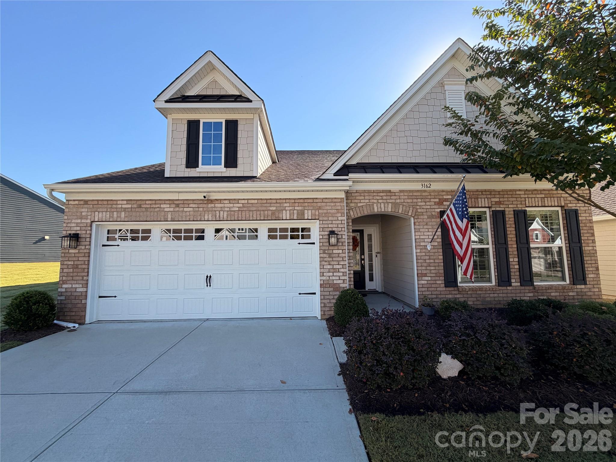 Welcome to easy, low-maintenance living in the highly sought-after 55+ active adult community in The Meadows at Windhaven! This beautifully maintained one-owner, single story home shows like a model and offers 3 bedrooms, 2-full, 1-half bathrooms, with updates galore and 2,178 square feet of thoughtfully designed living space. The open-concept floor plan features engineered hardwood flooring throughout living areas, ceramic tile bathrooms, custom wood plantation shutters throughout, cozy gas log fireplace in the great room, and an abundance of natural light. The gourmet kitchen is a chef’s dream with a large center island, quartz countertops, 5-burner gas cooktop, dual convection ovens, convection microwave, soft close cabinet pullout shelf organizers and 4-Door French Door refrigerator. The spacious primary suite offers a sitting area with entrance to the screened porch overlooking the lush lawn with irrigation system, a large walk-in closet, luxurious spa-like bath featuring double vanities, frameless walk-in shower enclosure with bench seating, linen closet, humidity-sensing exhaust fan, and private water closet. Enjoy peaceful mornings and relaxing evenings on the screened porch with adjacent private common space for family gatherings. HOA includes lawn maintenance, community pool, cabana pool house and playground. Move-in ready and meticulously cared for—this exceptional home combines comfort, convenience, and modern living in one of Tega Cay’s premier active adult communities. QUALIFIED BUYER TO RECEIVE A 1% LENDER CLOSING CREDIT with accepted contract. Contact listing agent for more details.