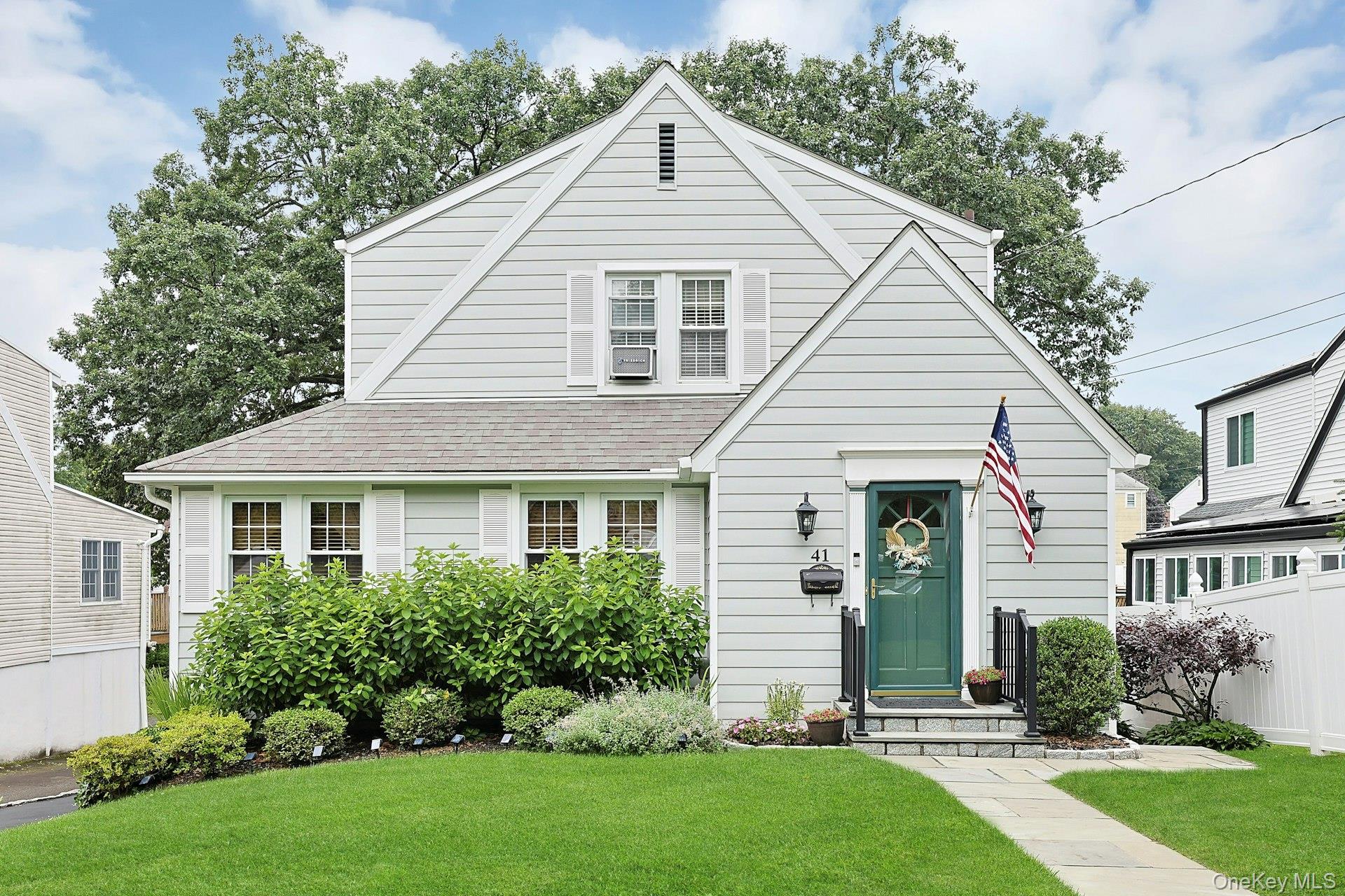 Classic charm pairs perfectly with today's lifestyle choices in this beautifully updated Colonial in Dunwoodie neighborhood. Home lives like 2534 with lower level. From the moment you step inside this home you will feel at home with original hardwood flooring with inlay. As you enter you will see powder room, inviting spacious living room appointed with brick fireplace, and French doors to formal dining room and sliders to deck are perfect for family gatherings. New custom kitchen features wood cabinets, quartz counters, stainless steel appliances, many pull outs and plenty of storage. On the 2nd floor you will find 3 bedrooms including primary bedroom with 3 double closets, and newer full bath.  Lower level consists of exercise room, family room, bar, and utility room.  Meticulously maintained level yard offers privacy with plenty of room for family fun. Many updates include kitchen, 25-year roof done in 2012, new composite siding, garage door, kitchen, bath, and newer windows, and much more.  Close to all! A pleasure to show.