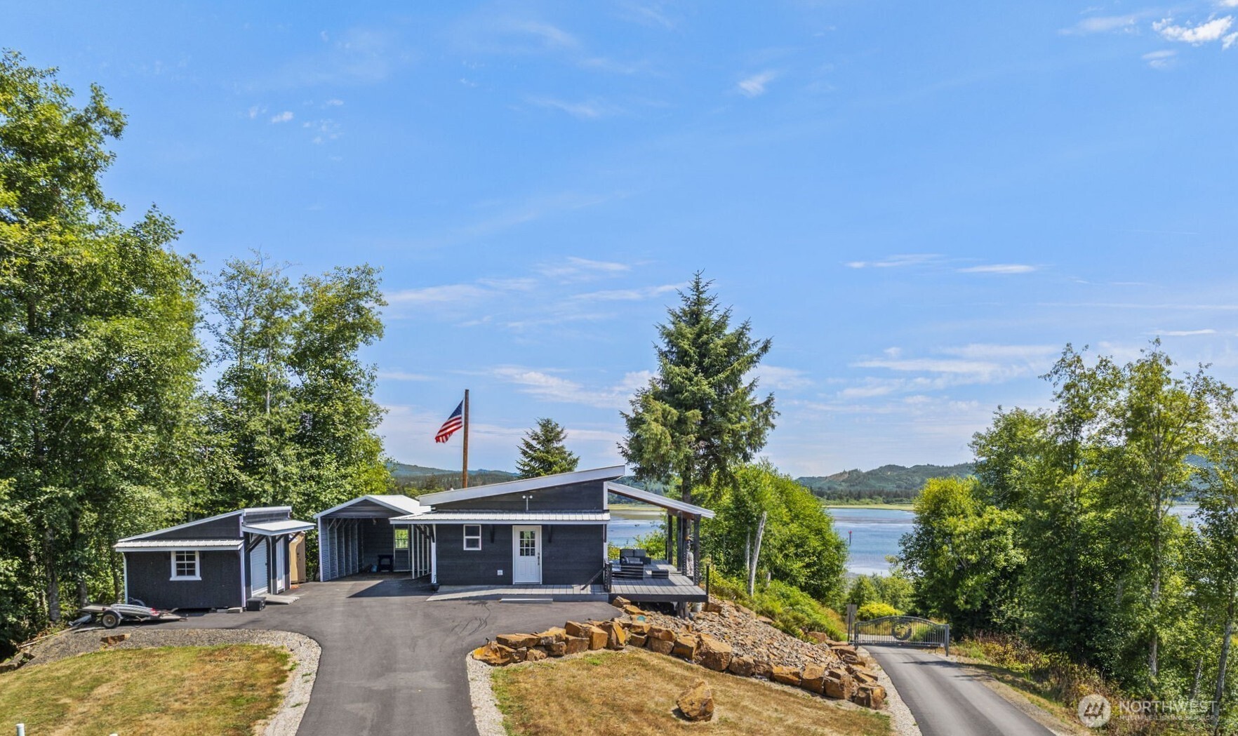 Rare Deep River @ Oneida Rd awaits; you will not believe these phenomenal Columbia River & territorial views of Oregon Hills.  Comes w/well-appointed custom industrial-inspired STUDIO home. Private, gated community is surrounded by privately owned greenbelt. Deer, Elk & other wildlife frequently visit. Enjoy the EZ care, stained concrete floors, ductless HVAC, half-vault slant ceilings w/transom windows & two 10' roll up glass doors for true indoor/outdoor living.  Large bath houses W/D & no-step shower. Expansive covered Trex deck, 12x20 shed w/roll up & man door, 12x24 metal covered parking, prepped for future addition of living space - add a bedroom with ease!  RV spot w/propane & 50-amp power (charge your EV!) NOT a DRIVE BY - gated!